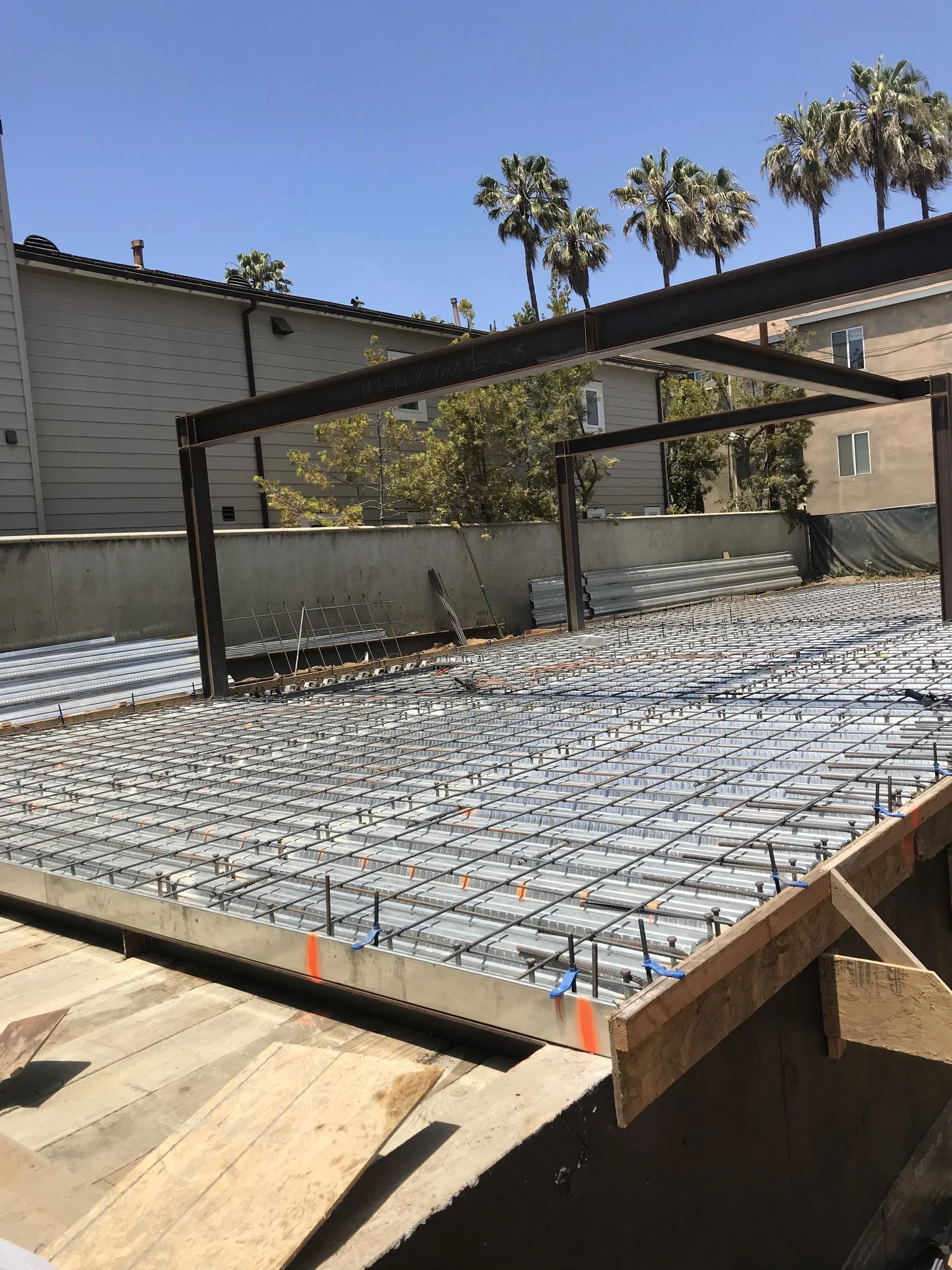 [new-construction] Steel moment frame with metal deck and rebar mat for an elevated structural slab in Santa Monica