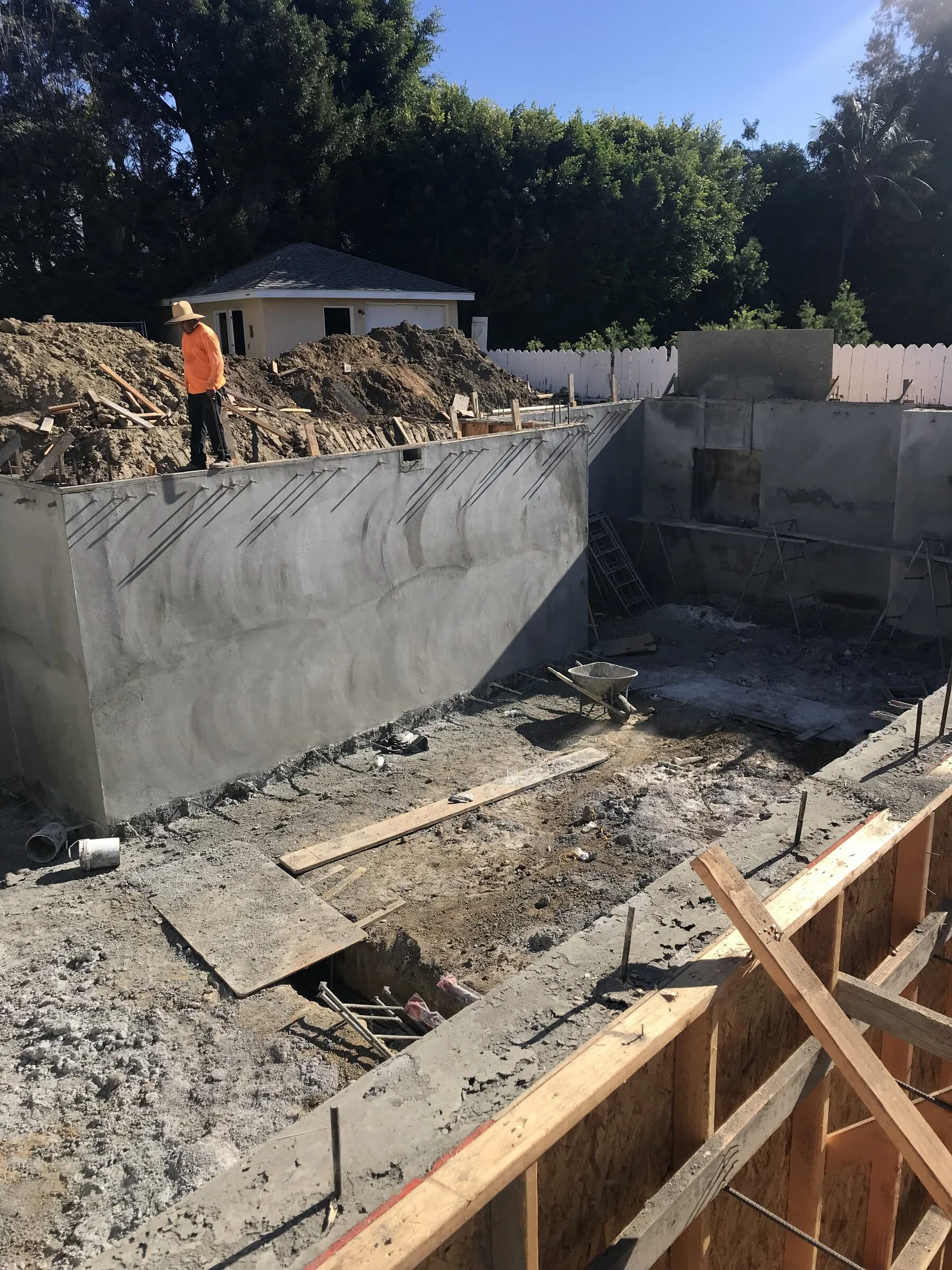[new-construction] Poured concrete foundation walls and excavation on a ground-up custom home in Los Angeles