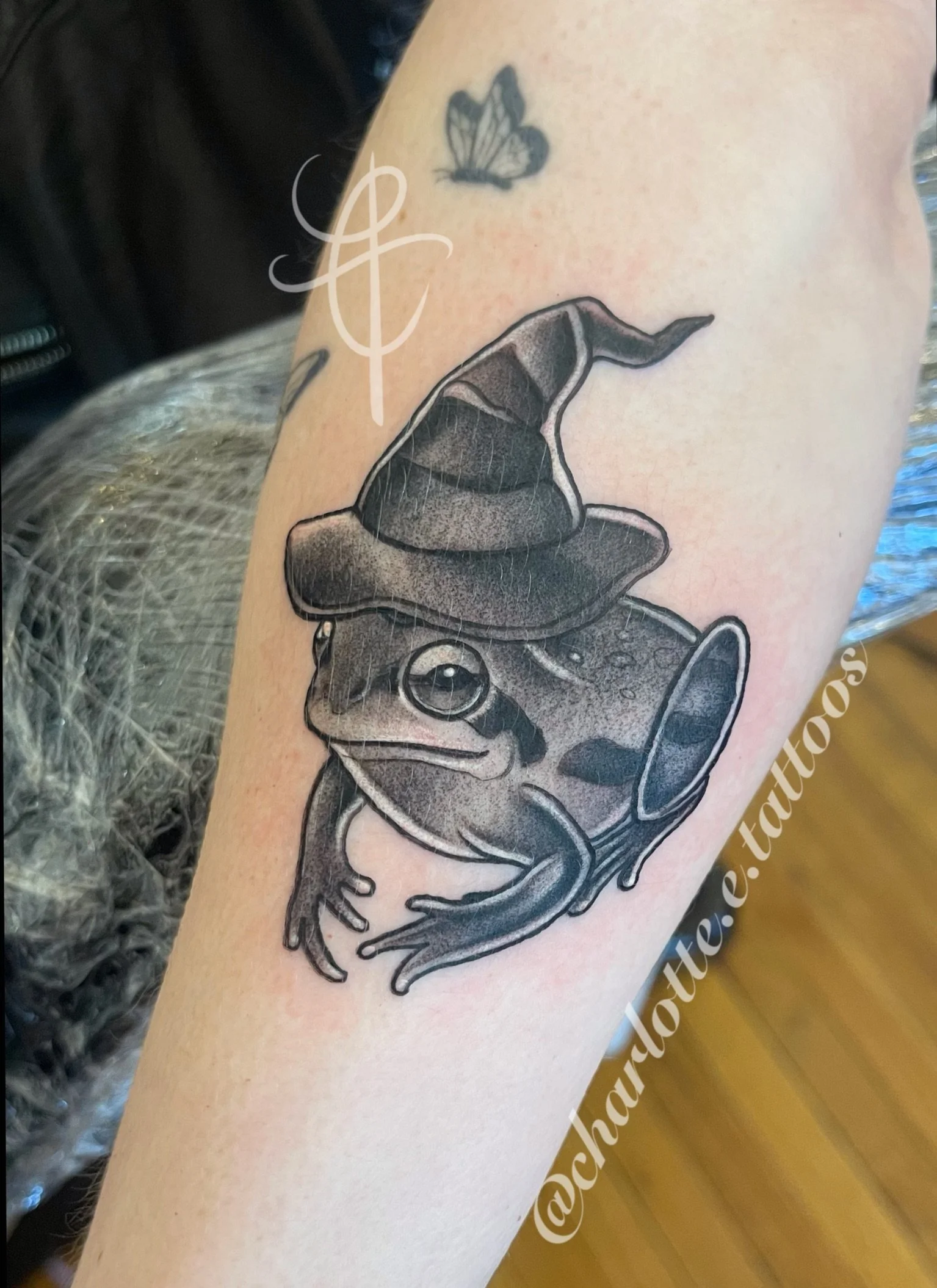 Neo-traditional, black and gray, spooky Halloween themed frog witch tattoo made by Charlotte Timmons.  