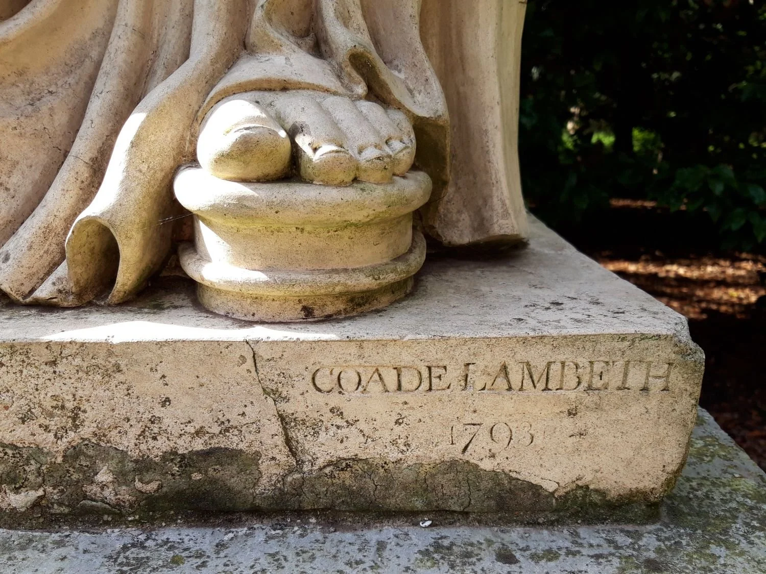 Coade stone visibly stamped with the company name.
