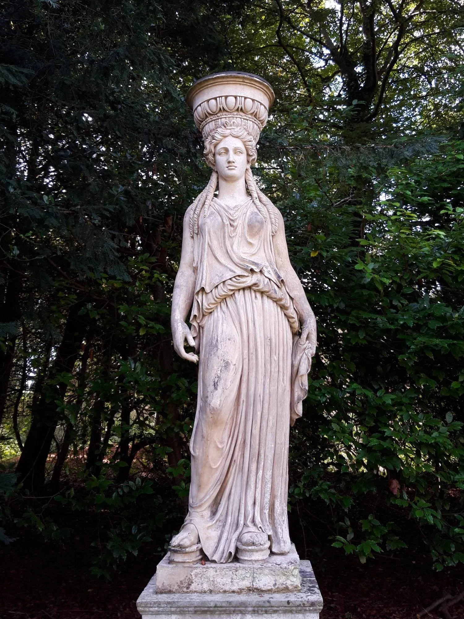 A classical caryatid in Coade stone