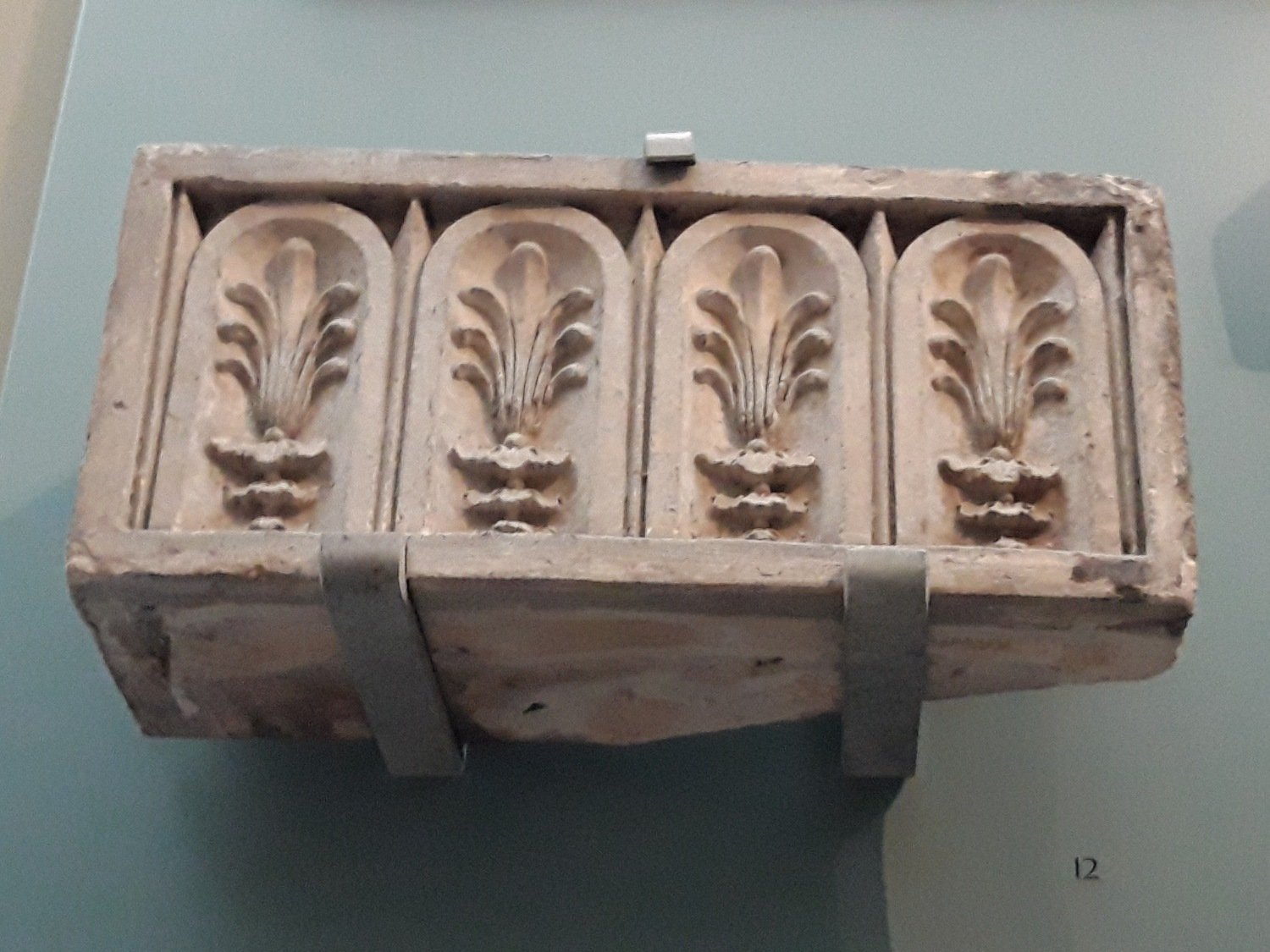 Coade stone impost block in the V&A Museum.