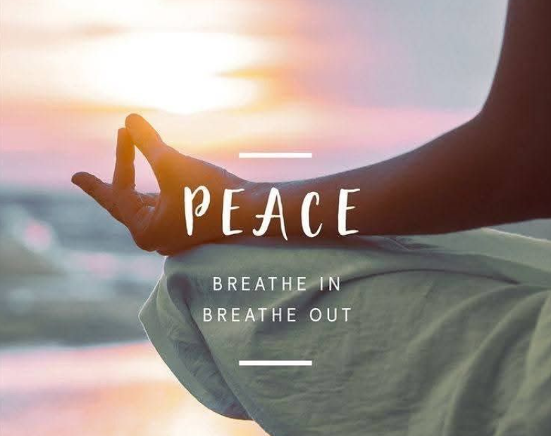 A person practicing yoga outdoors at sunset, sitting cross-legged in a meditation pose, with hands in Gyan mudra against a calming background, promoting peace and mindfulness.