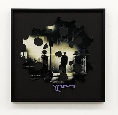Silhouette of a person standing beneath a lamppost with a circular cutout design in black with some purple elements.