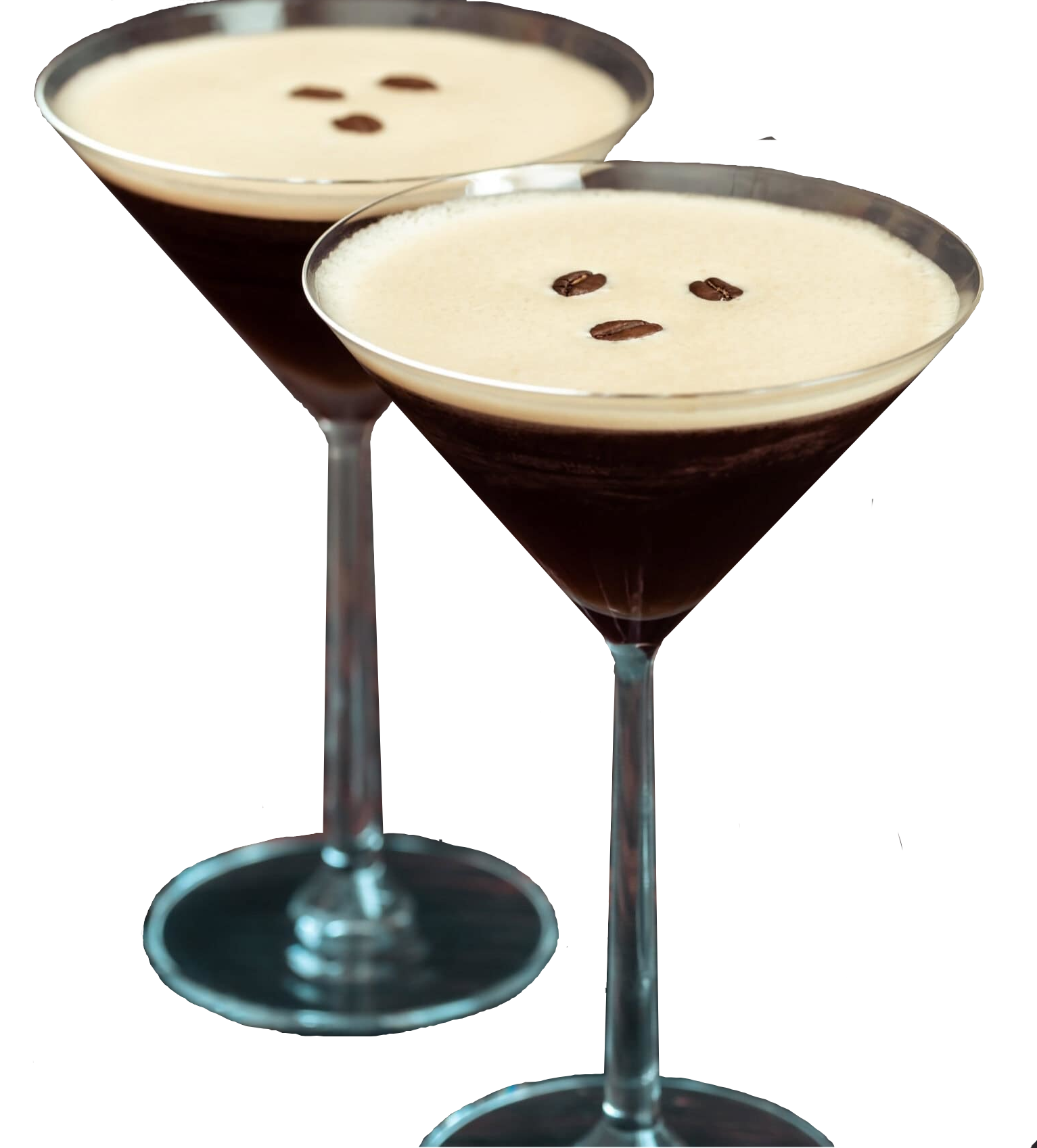 Two martini glasses filled with an espresso martini cocktail.