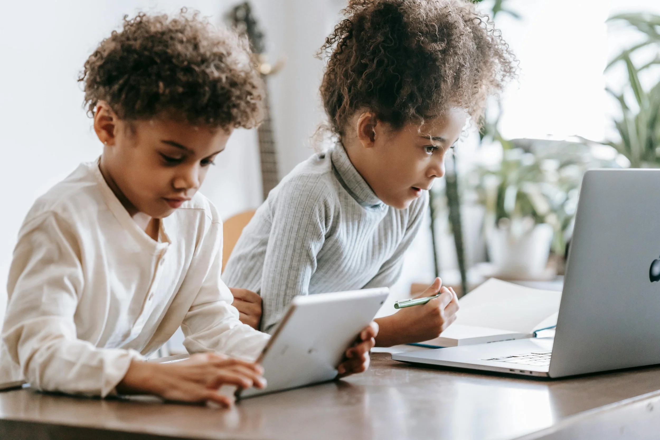 Two Children on a laptop and tablet
