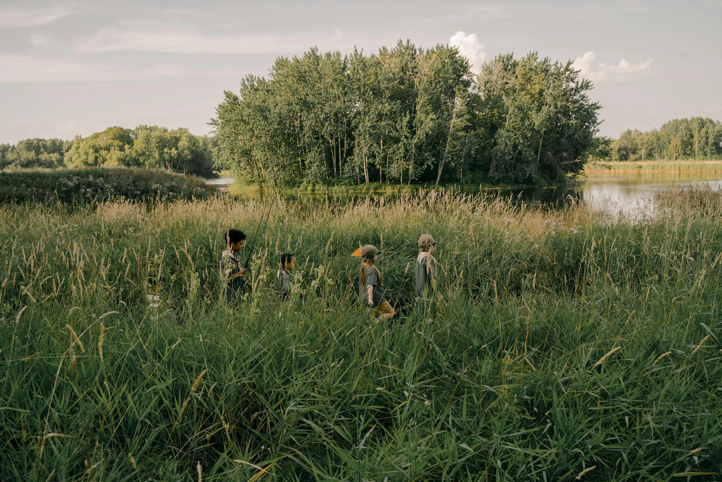 children exploring grasslands