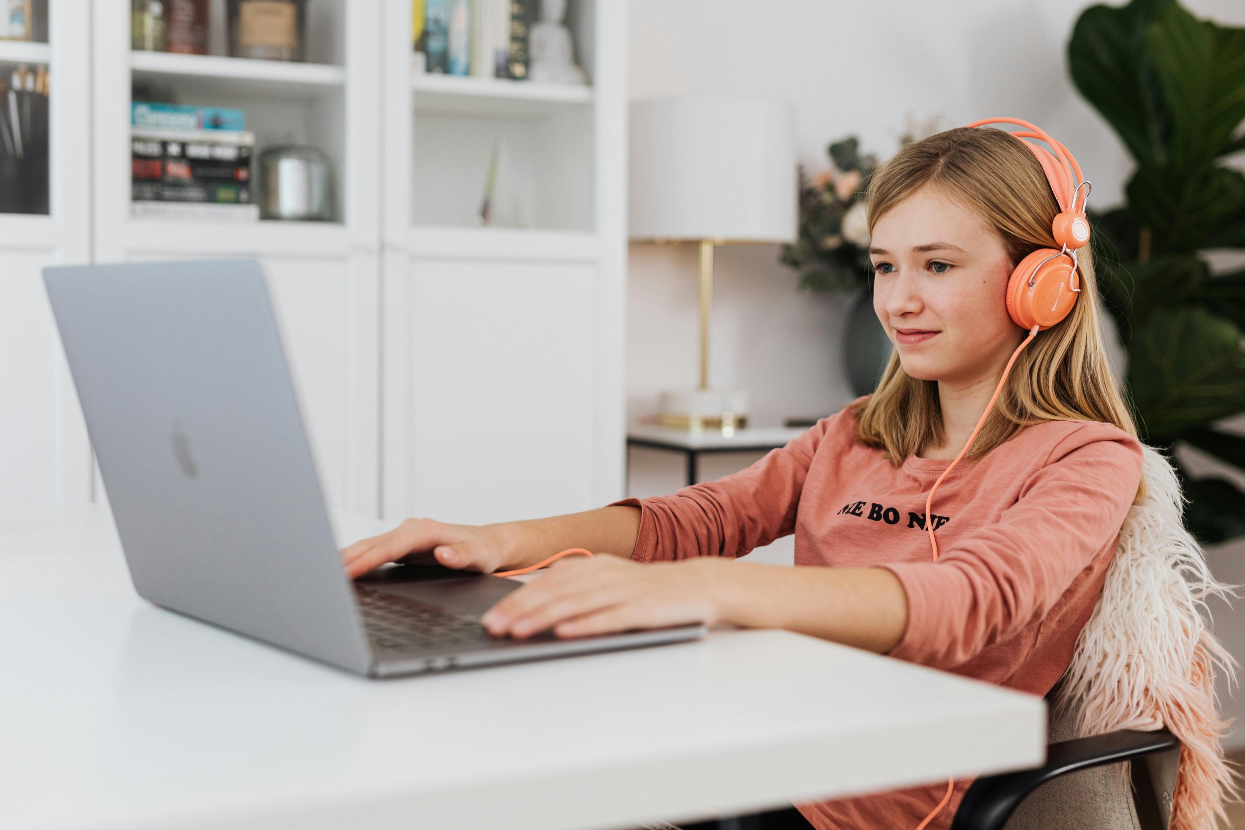 A student sitting on their computer