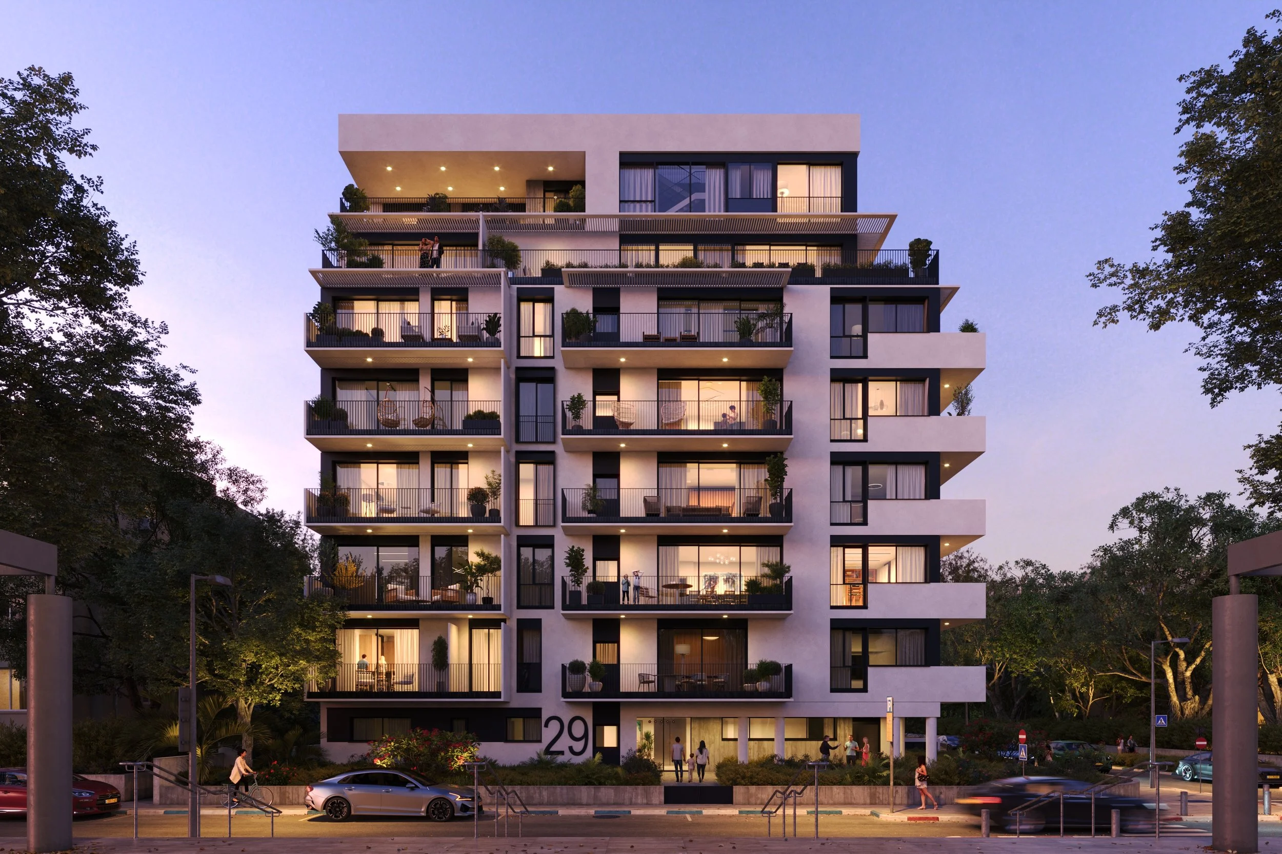 A modern multi-story apartment building with balconies at dusk, surrounded by trees and a street with parked cars and pedestrians.