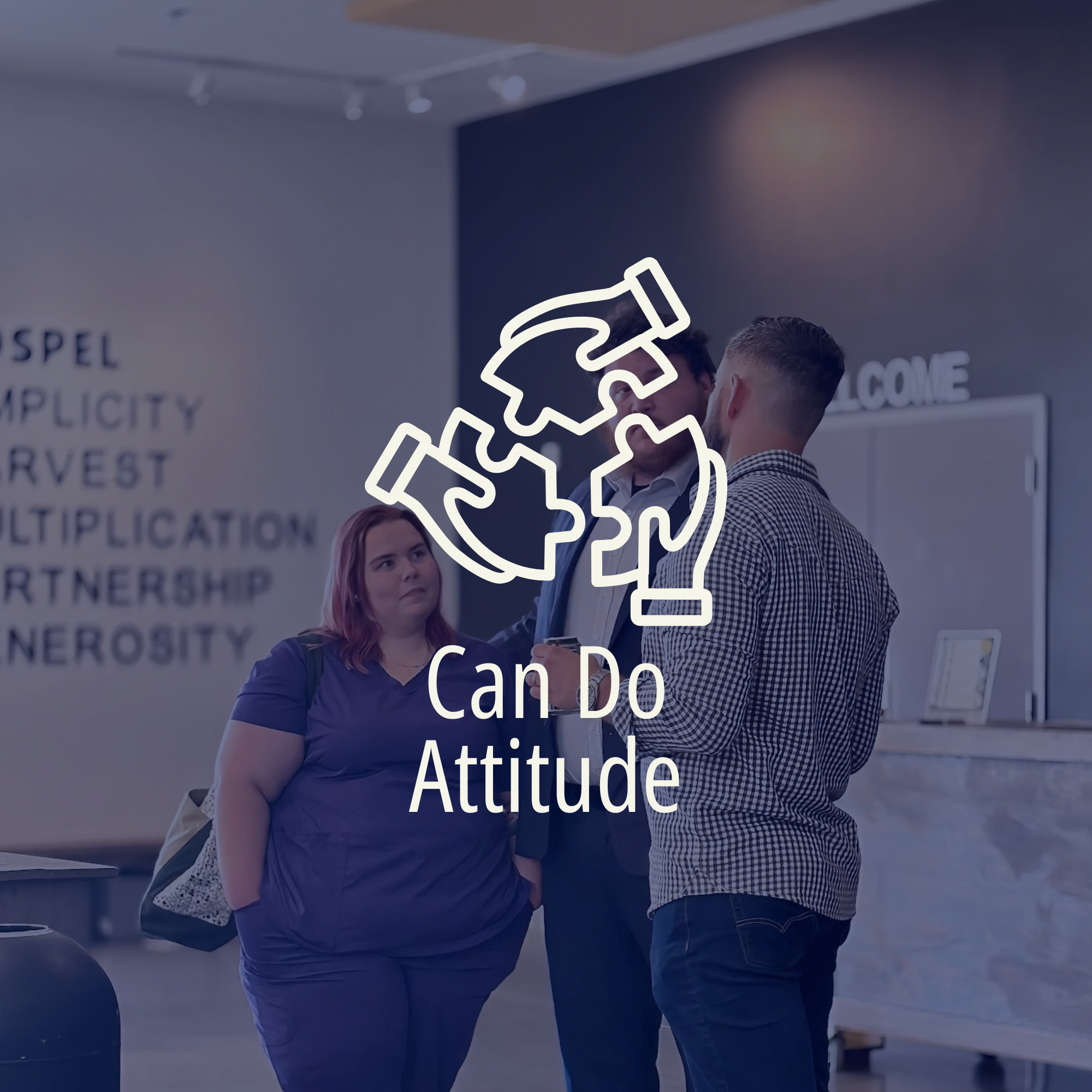Two men are having a conversation in a professional setting with a woman. There is a large outlined graphic of a handshake with the text "I can do attitude" overlaid on the image.
