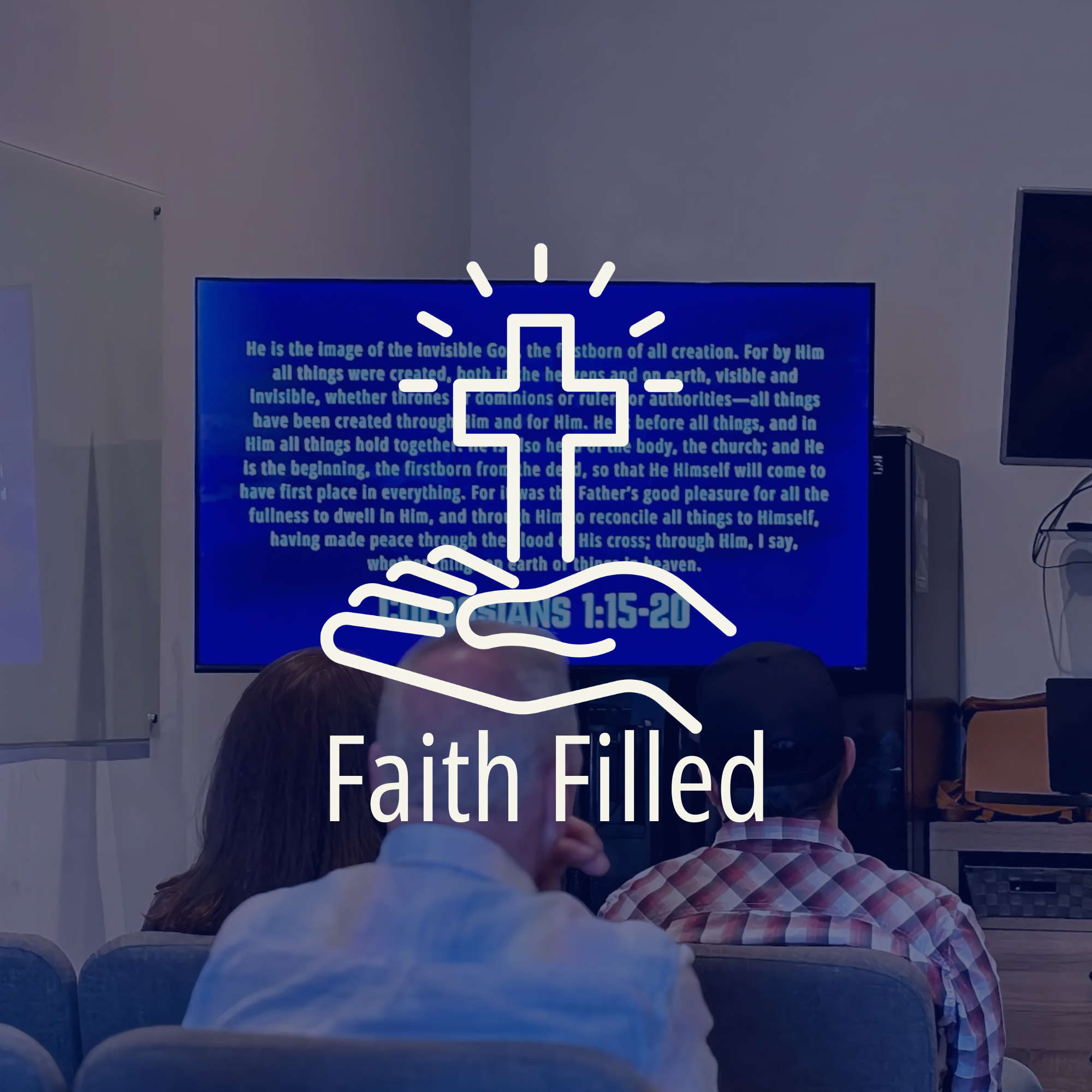 A group of people sitting in a room watching a presentation on a large screen displaying a Bible passage from Ephesians 1:15-20. The room has plain walls, and the audience includes people with different hair colors and styles, some wearing plaid shirts.