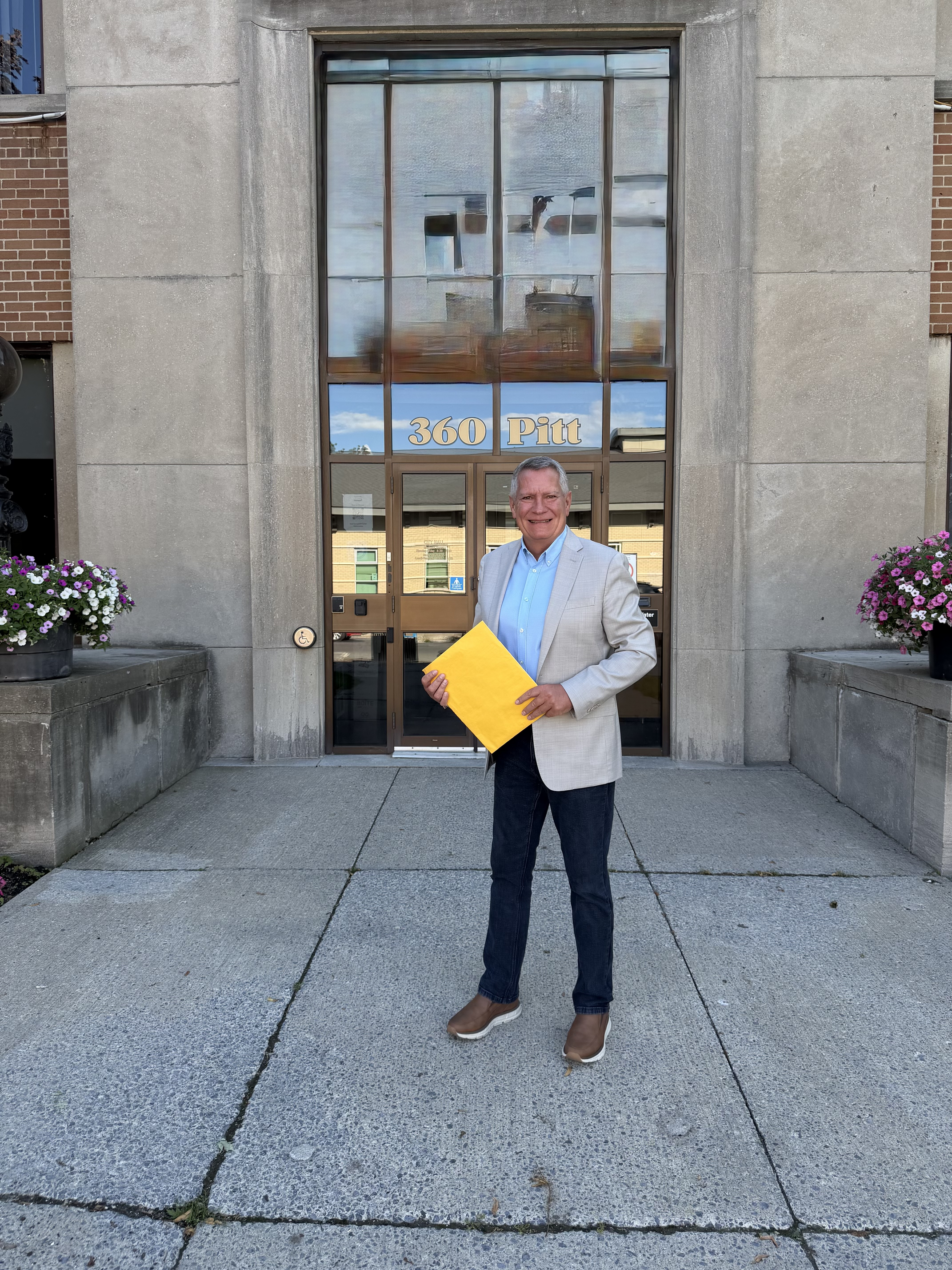 Todd Lalonde, candidate for Cornwall City Council, standing outside Cornwall City Hall at 360 Pitt Street.