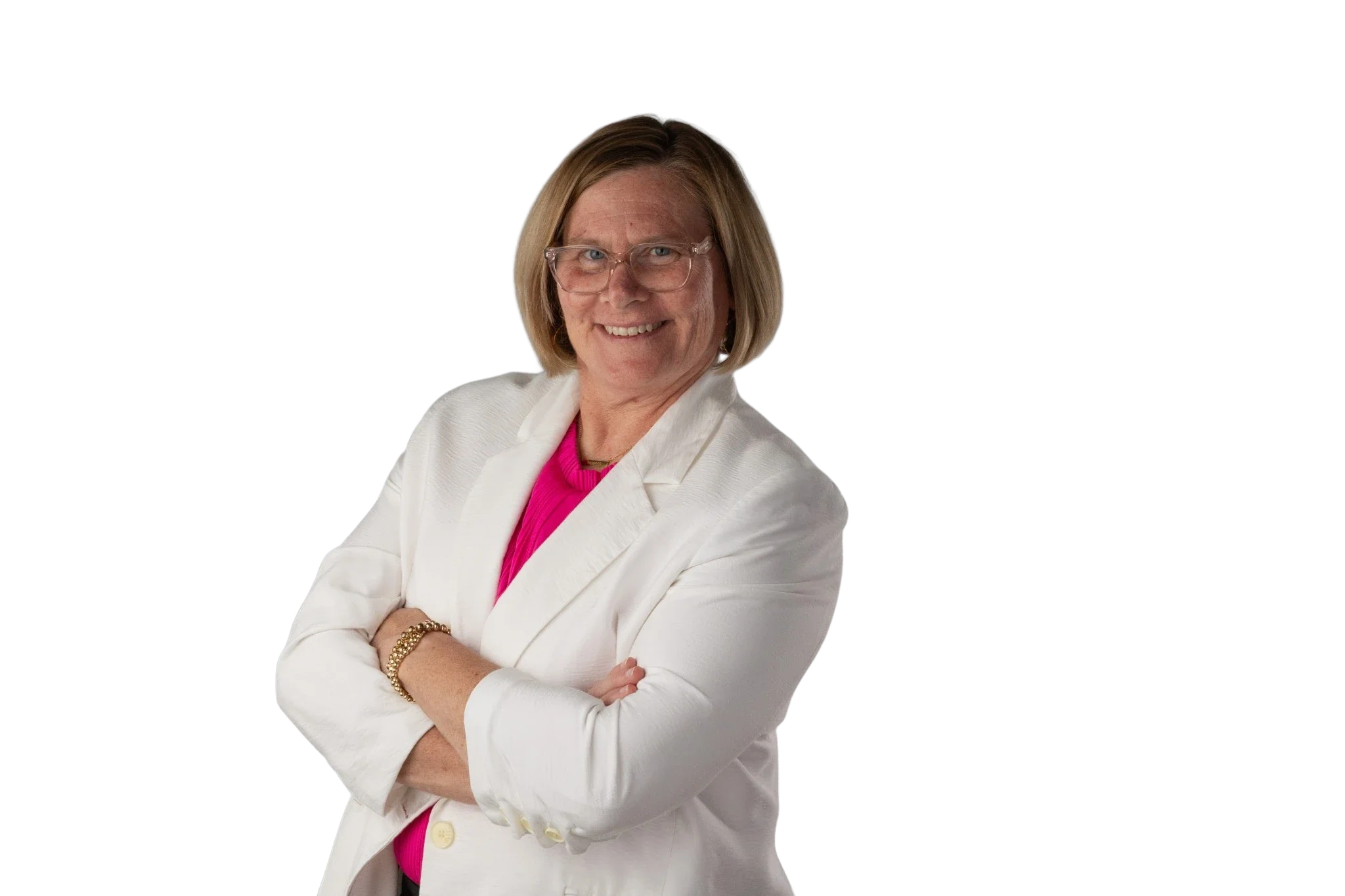 Jen Brooks in a white blazer and pink top, smiling with her arms crossed.