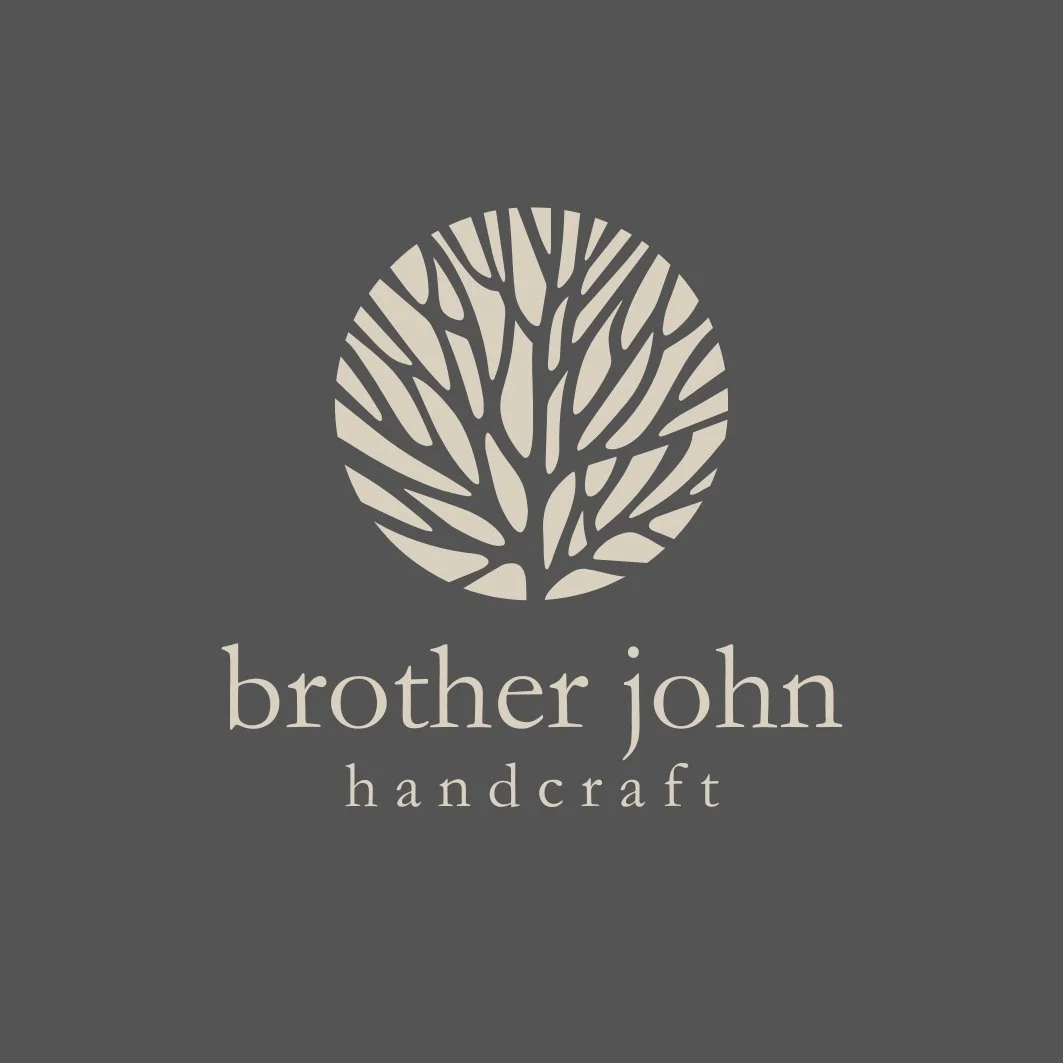 Logo for Brother John Handcraft featuring a stylized tree inside a circle on a gray background.