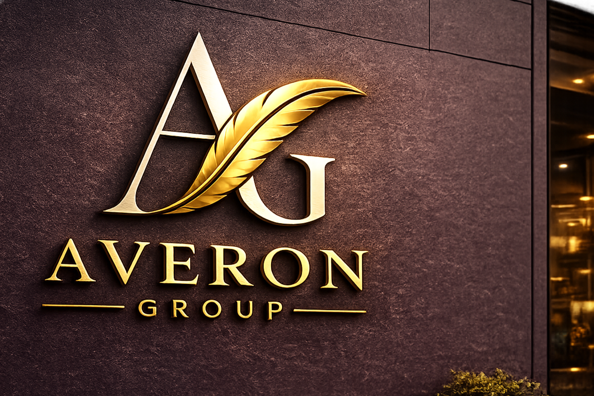 Gold and beige sign with a stylized leaf, the text 'Averon Group' on a dark, textured wall.