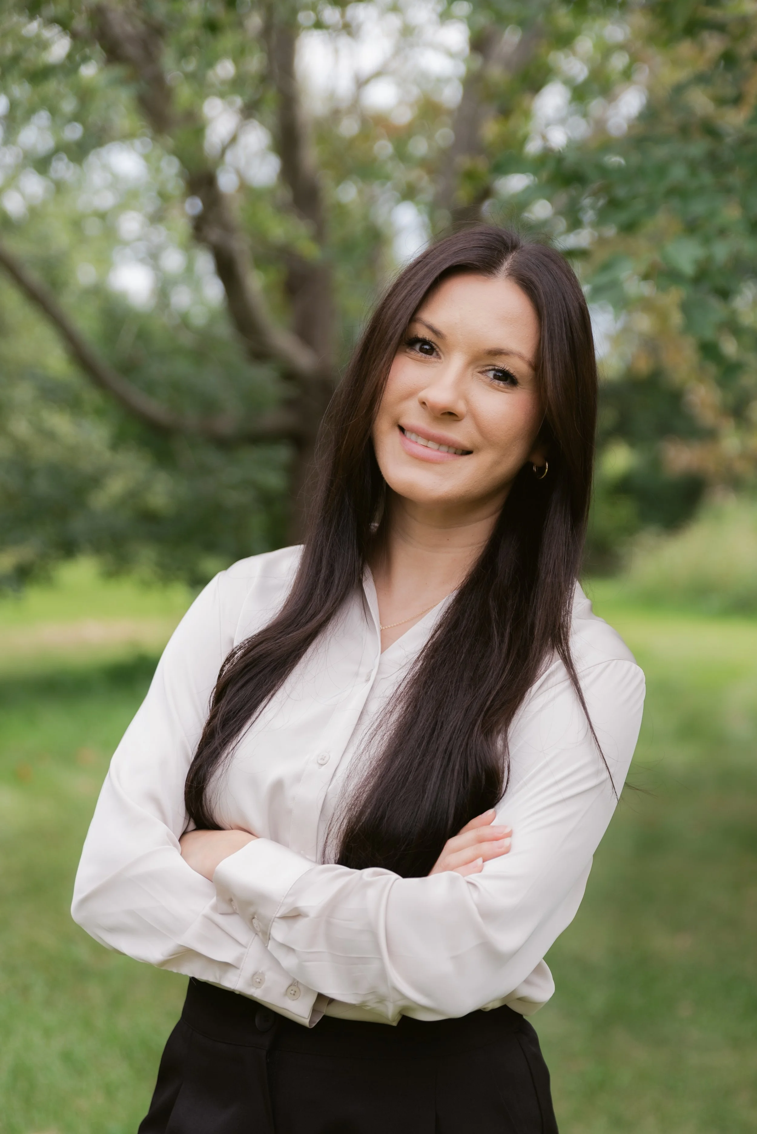 Carrera & Pasillas Therapy therapist standing outdoors. Professional therapist headshot.