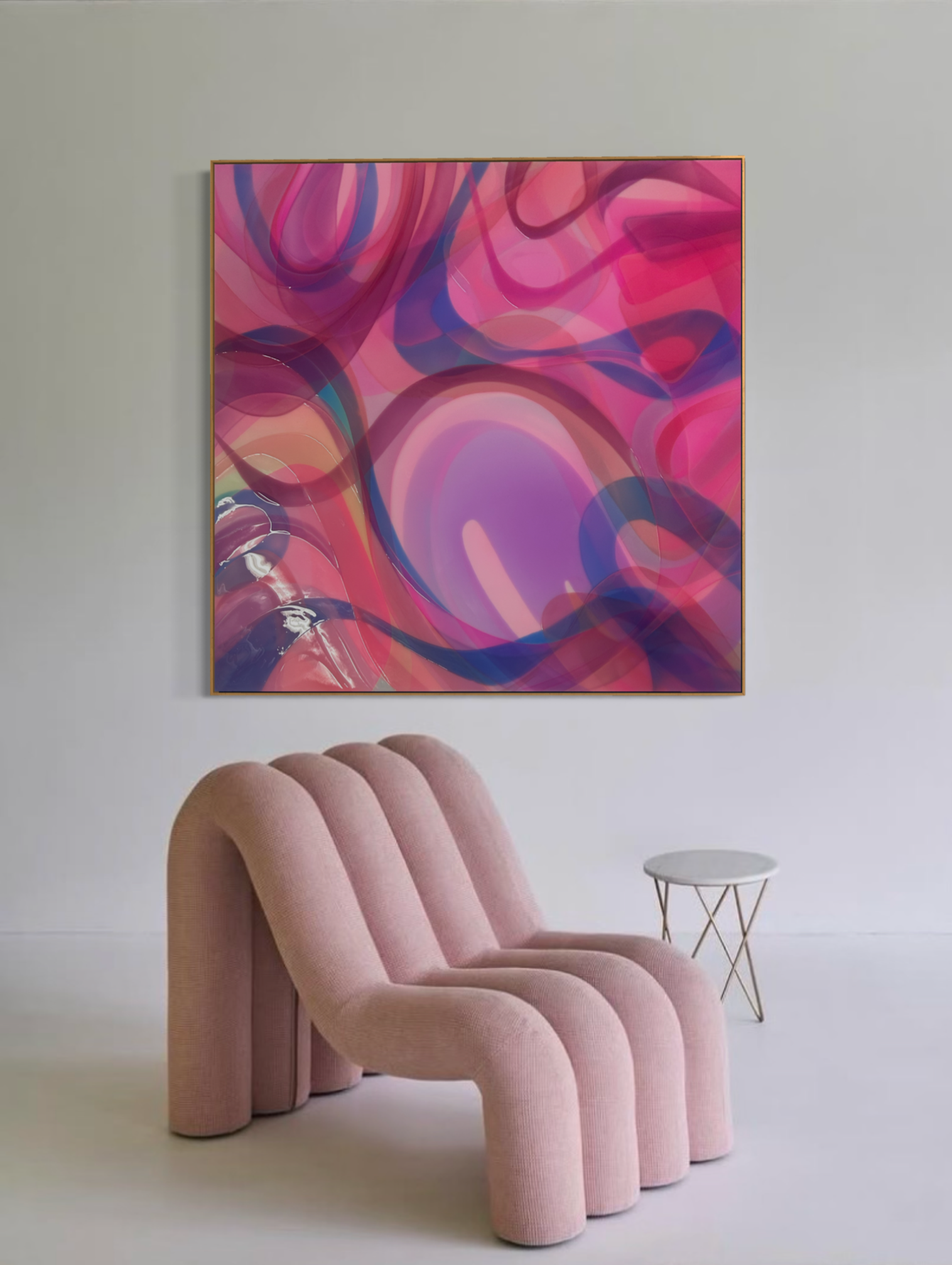 A modern pink upholstered chair with a rounded, plush design sitting in front of a light gray wall. Behind the chair is a large, colorful abstract painting with swirls of pink, purple, and blue. To the right of the chair, there is a small round white side table with thin golden legs.