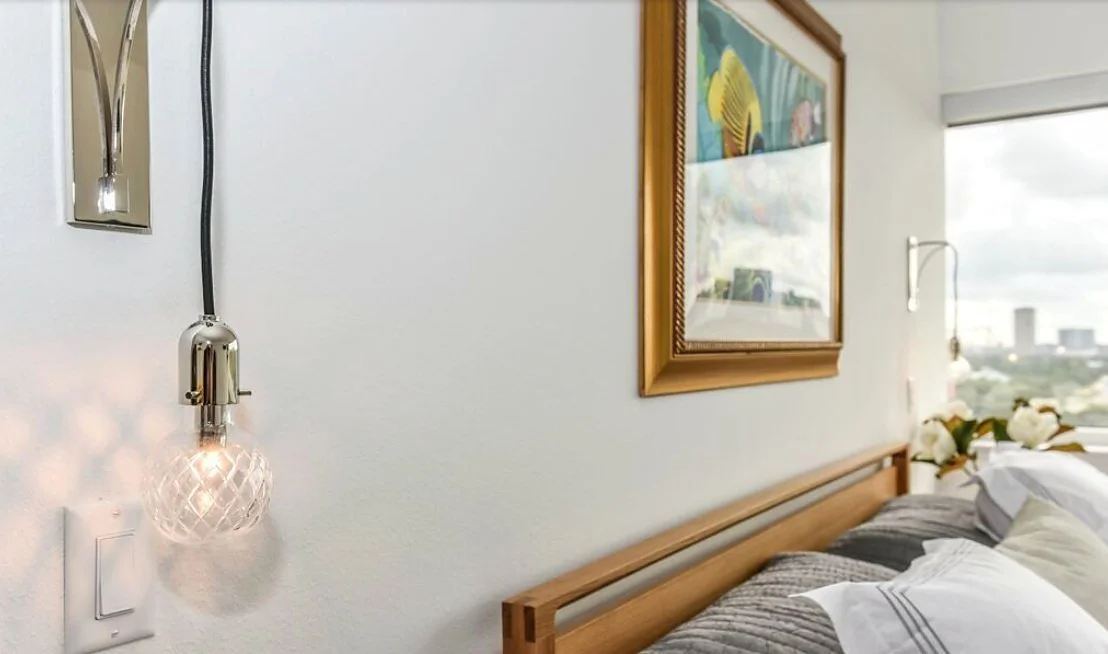 09-bedroom-sconces-and-art.jpg