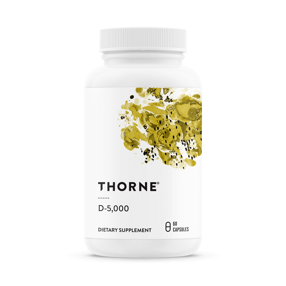 White bottle of dietary supplement labeled 'Thorne D-5,000' with a white cap and a design of yellow and black abstract shapes on the label.