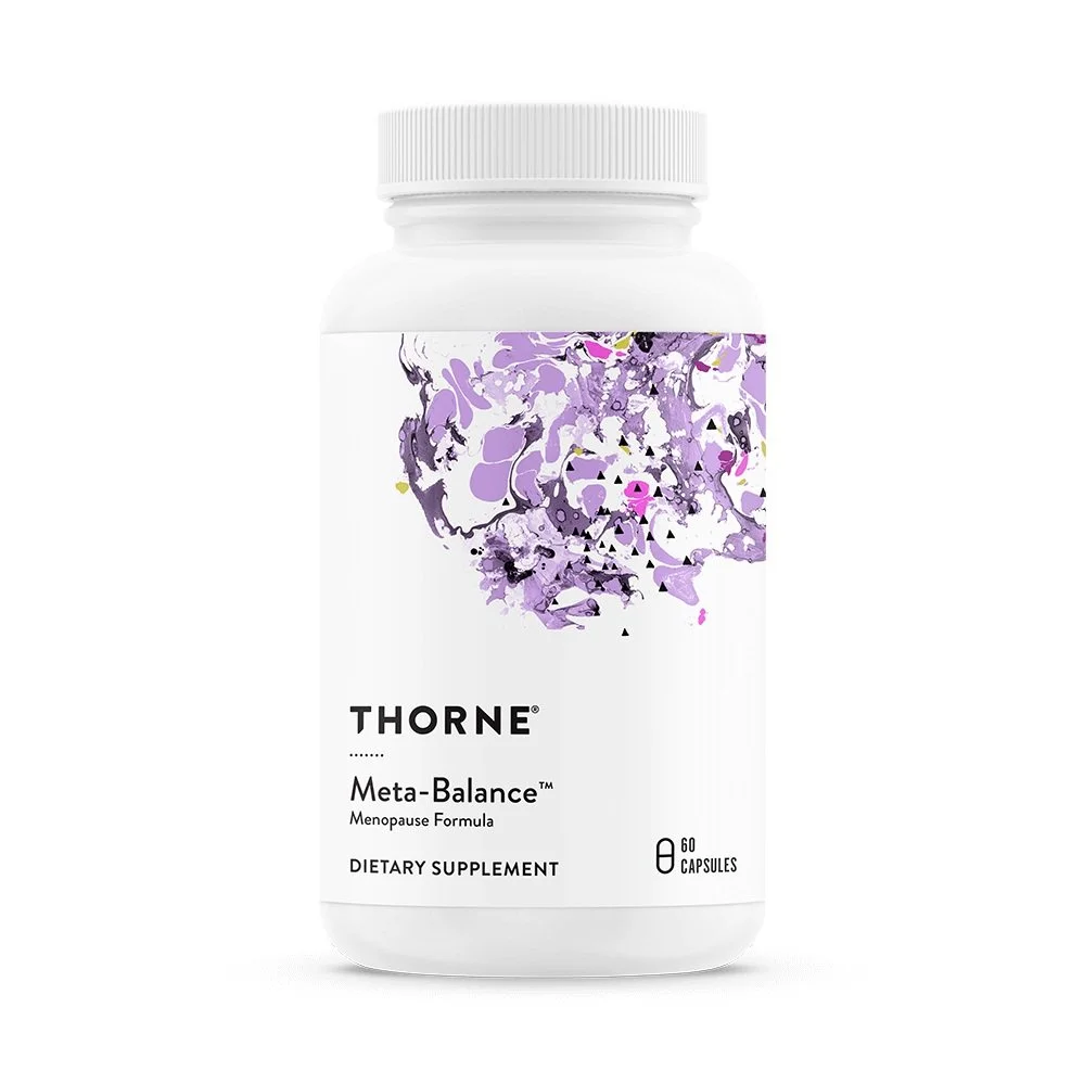 White bottle of Thorne Meta-Balance dietary supplement with purple and black abstract art on the label.