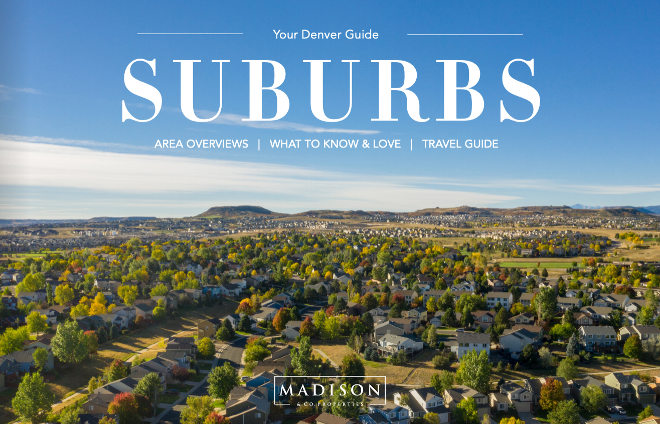Cover of a travel guide titled 'Suburbs' with an aerial view of a suburban neighborhood, including houses and trees, under a blue sky in Denver, Colorado.