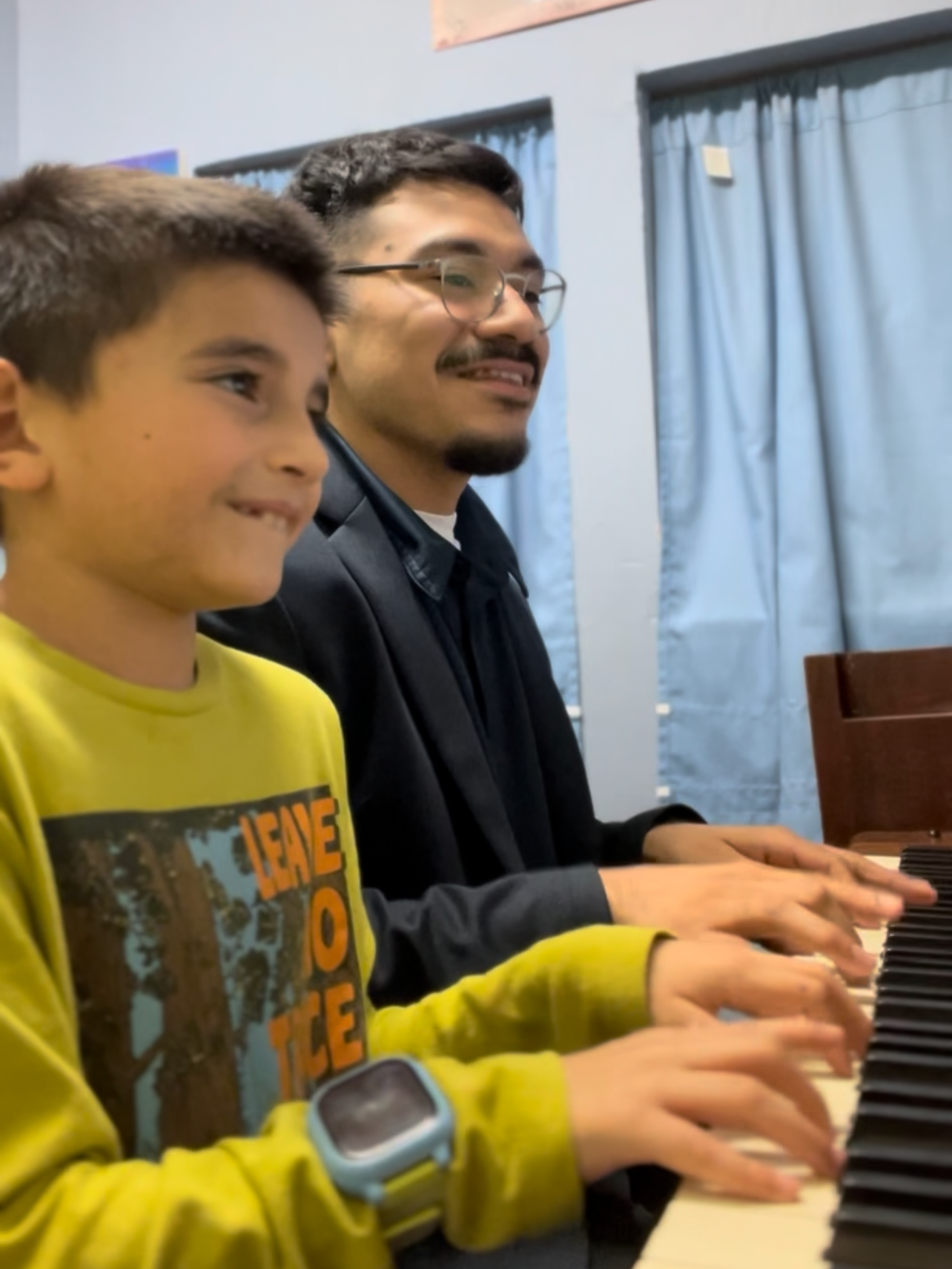 Saul Sanchez teaching a young piano student at Practice Music School near Lewisville, TX