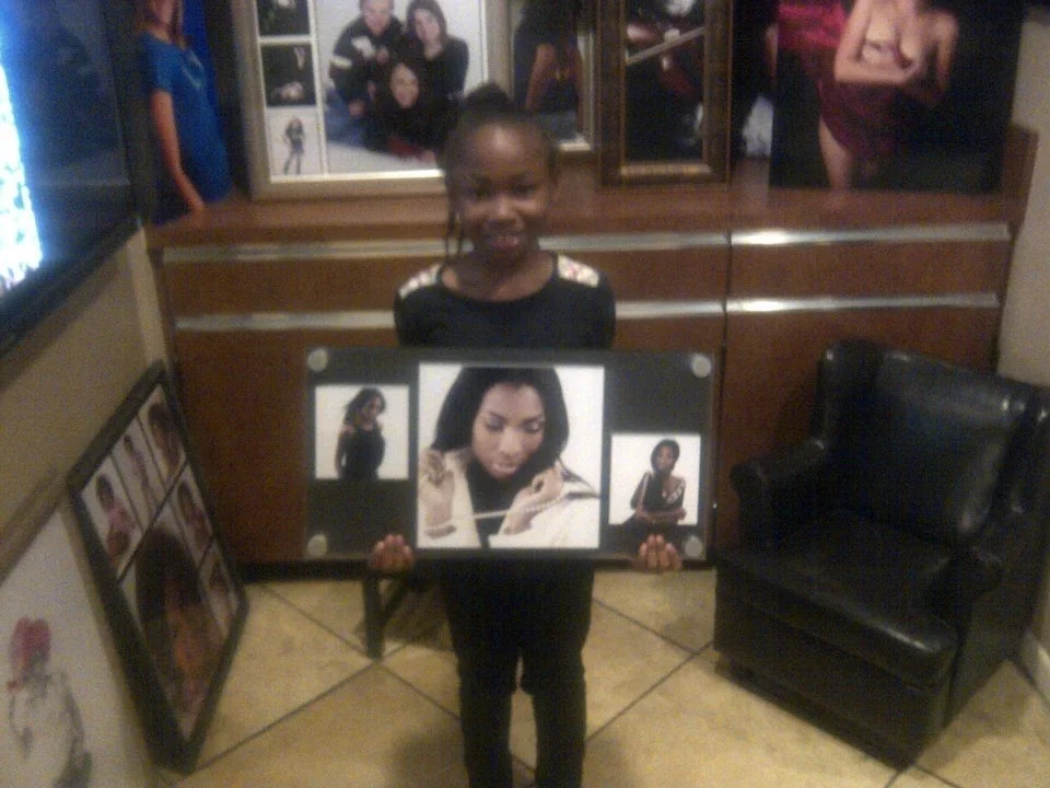 A young Kaliyah holding her mom, Kami Divines work. The National Frame of Glamour Shots Ad