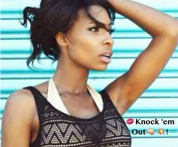 A woman with short black hair, tan skin, and wearing a black lace top, is looking to the side with her hand resting on her forehead against a blue striped background. The image includes a caption with a red lips emoji, the phrase "Knock 'em Out," a f