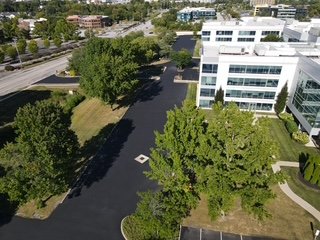 Aerial view of a modern office building with fresh coat of sealcoat.
