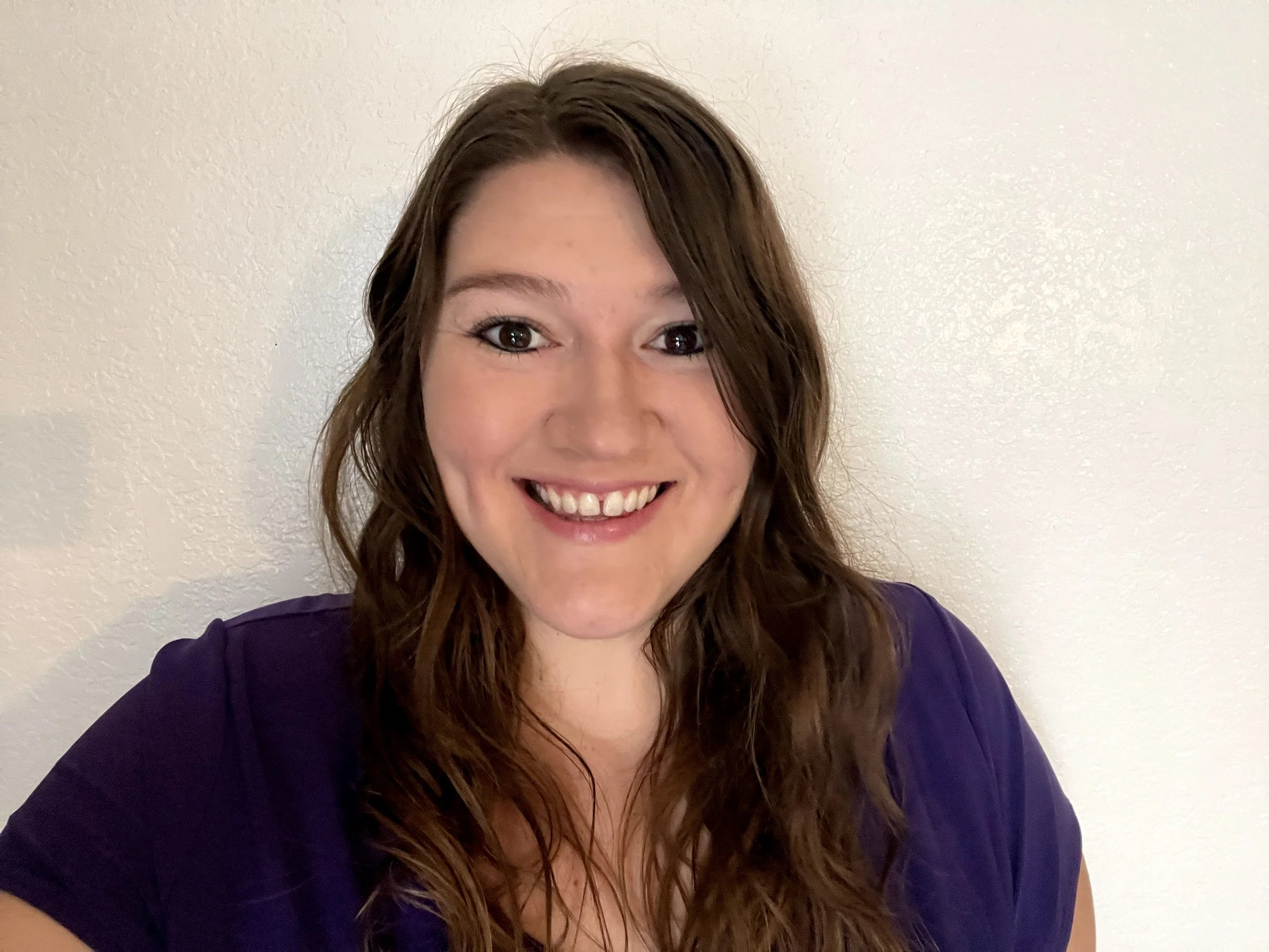 Dr. Kayla Clark, licensed clinical psychologist providing virtual therapy for adults throughout California.