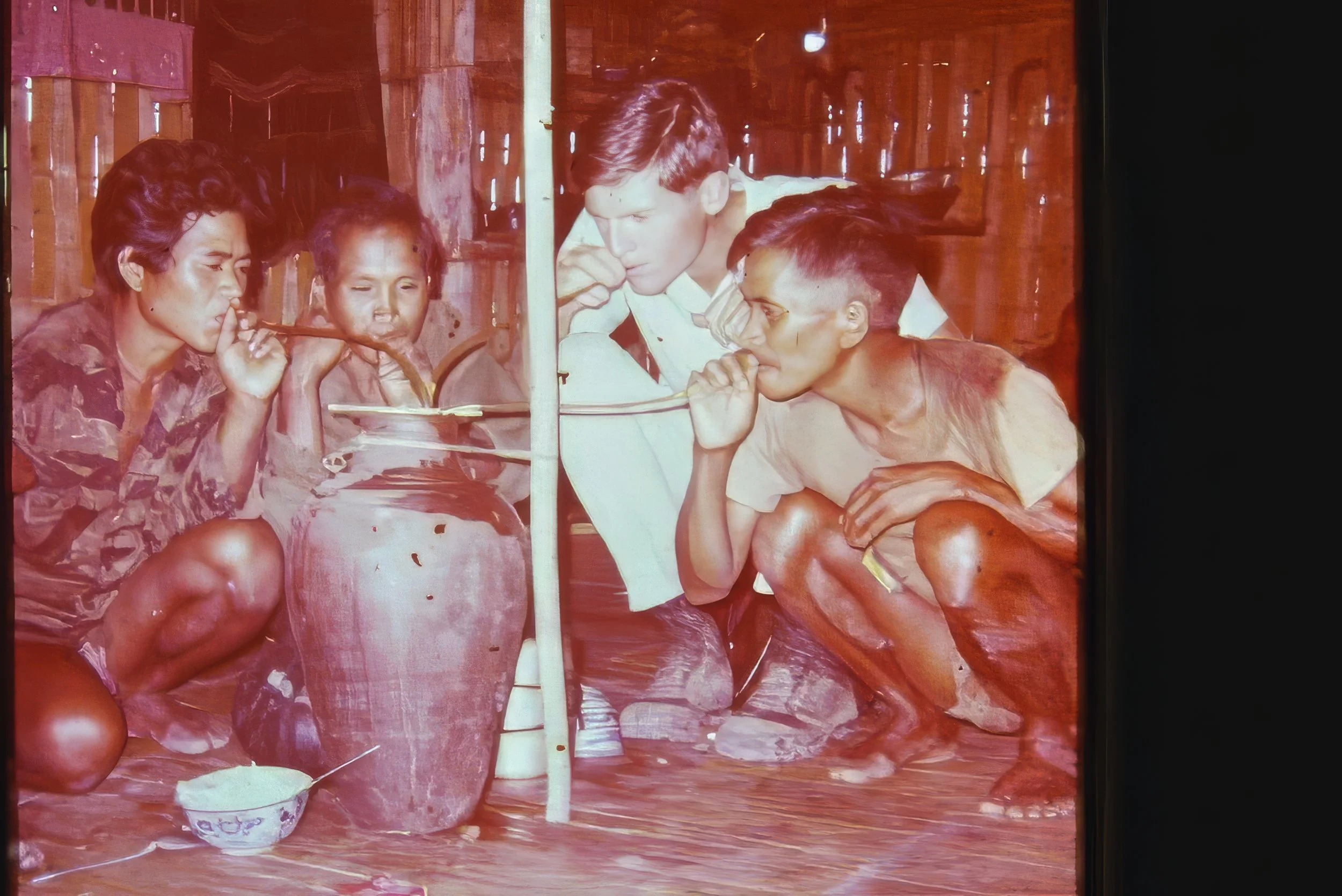 Sipping rice wine after a hard day's work. Vietnam
