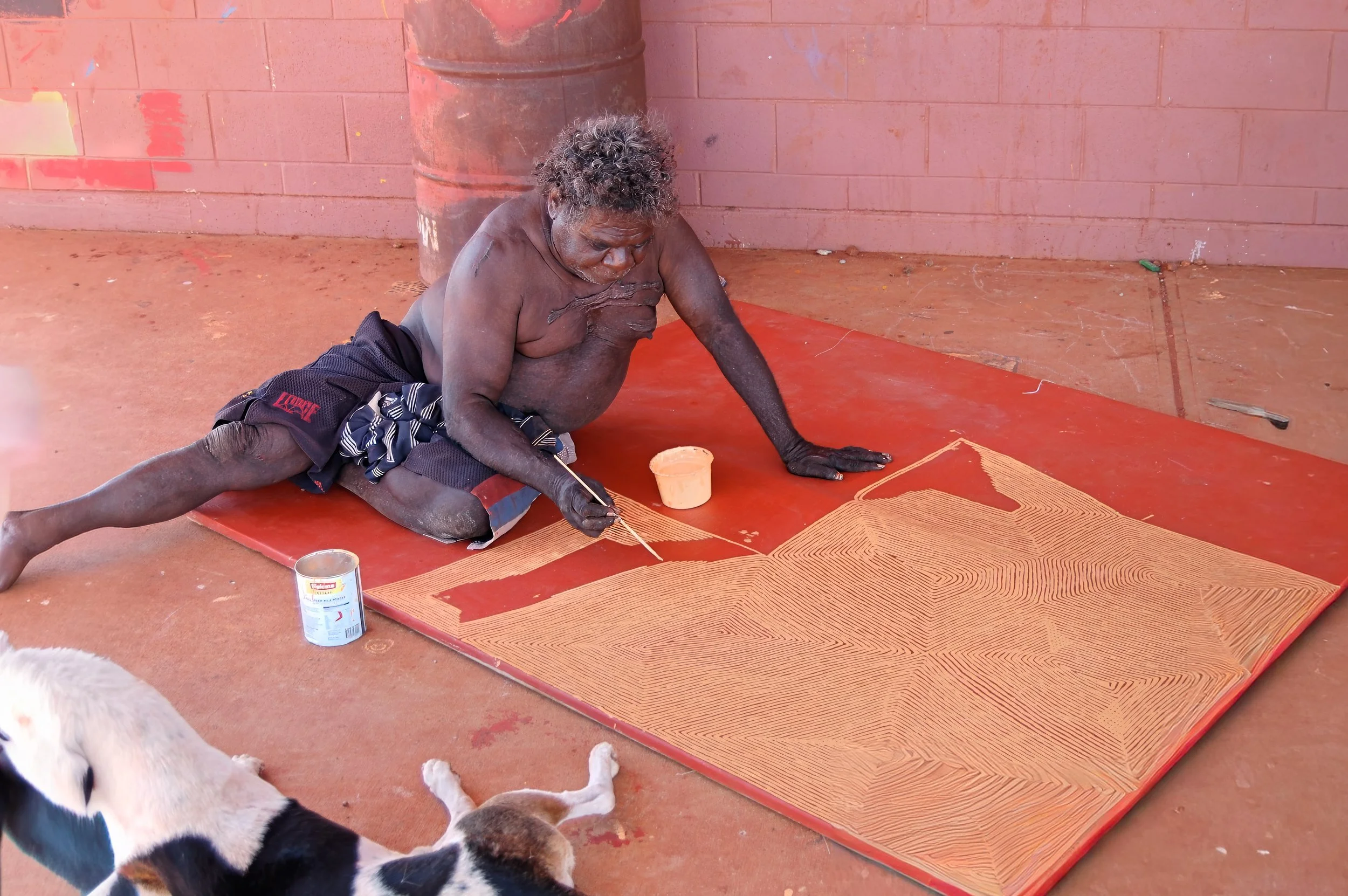 Artist painting his dream on Belgian linen. Kintore, Australian Outback