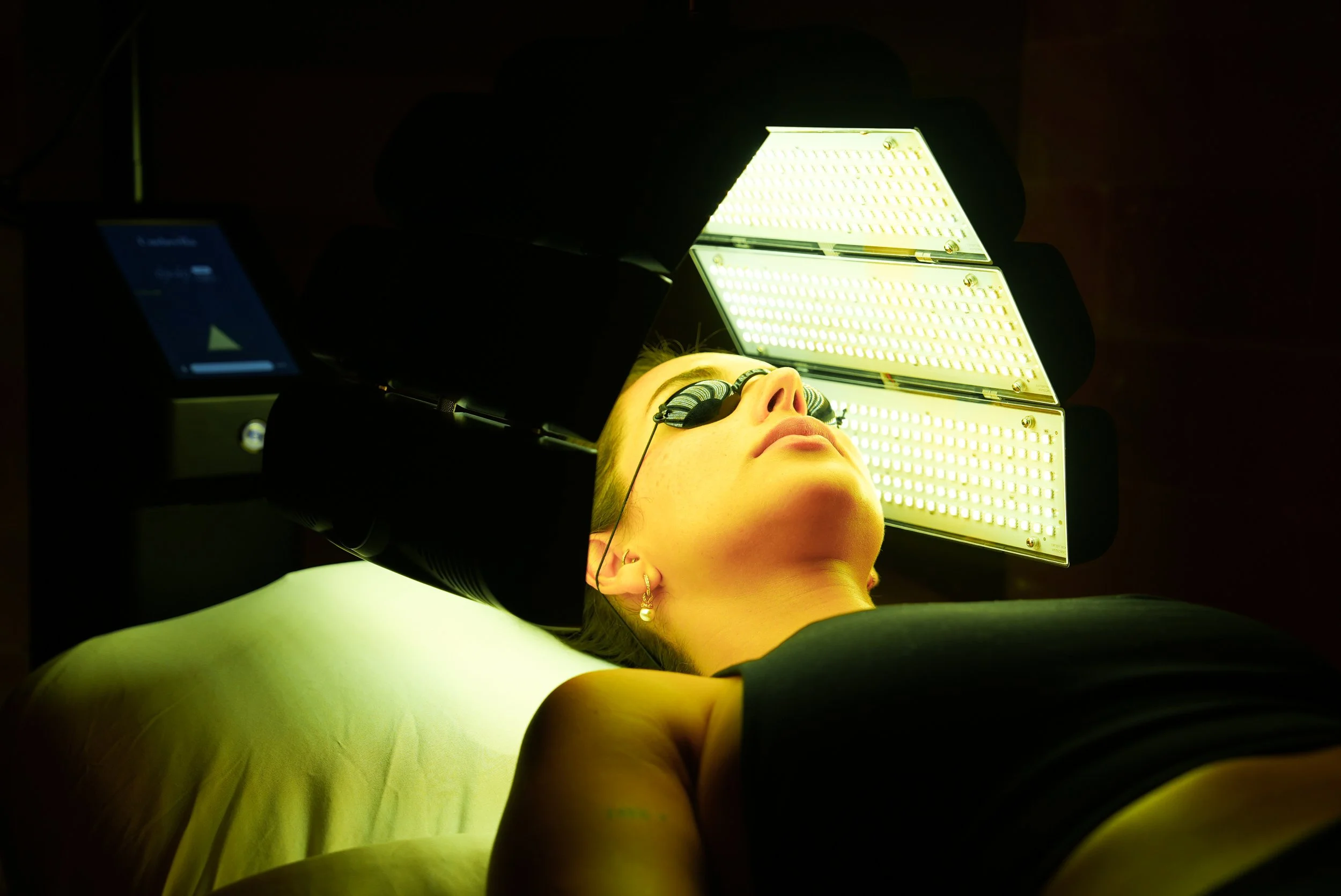 Umbrella Yellow Light on Face Laying Down on Med Bed.jpg
