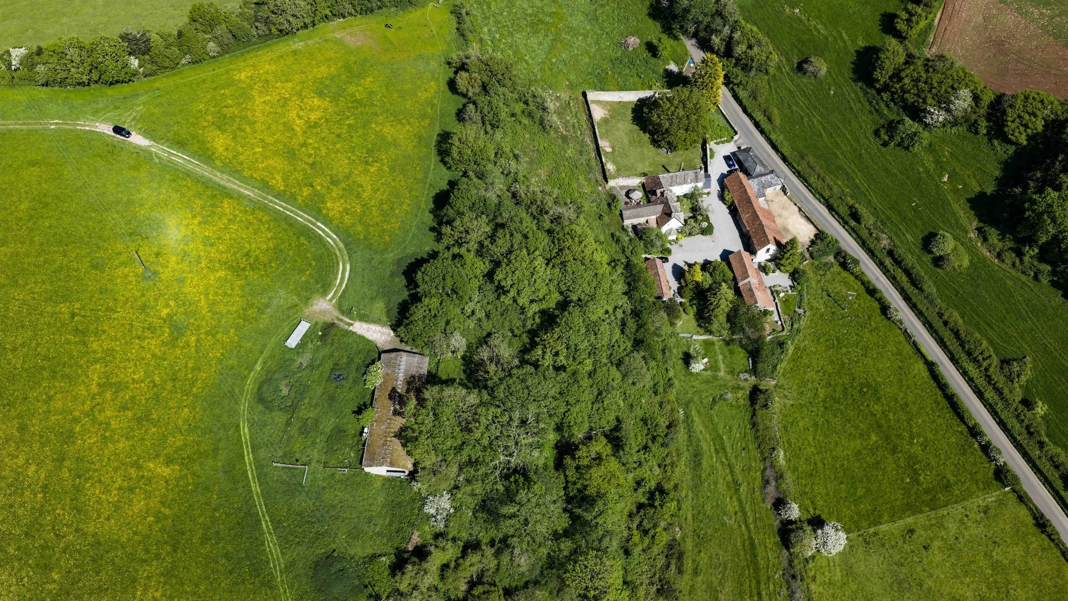 Aerial view of From Stone To Sky showing the farmstead, production areas, access tracks and surrounding fields.