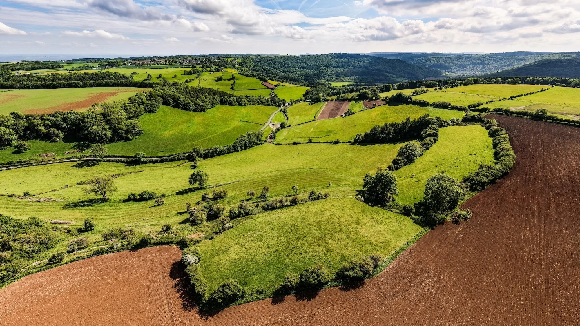 Private hilltop plateau overlooking the Wye Valley National Landscape with panoramic countryside views and open filming landscape.