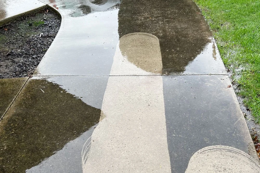 pathway being cleaned by water blaster