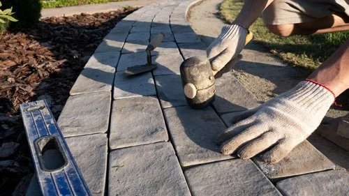 landscaping and laying paving stones