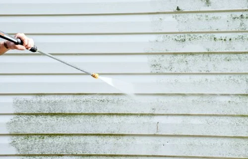 Exterior water blasting mouldy weather boards