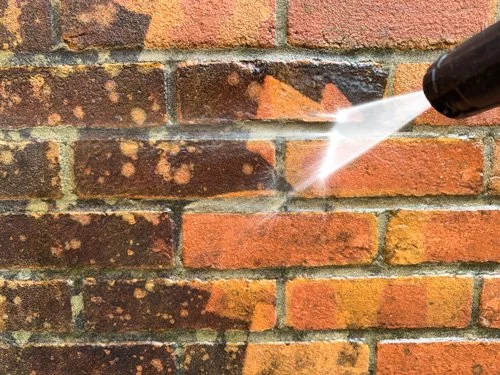 pressure washing dirty bricks