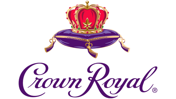 A graphic of a royal crown with red and gold details placed on a purple cushion with tassels, above the word 'Crown Royal' written in purple cursive font.