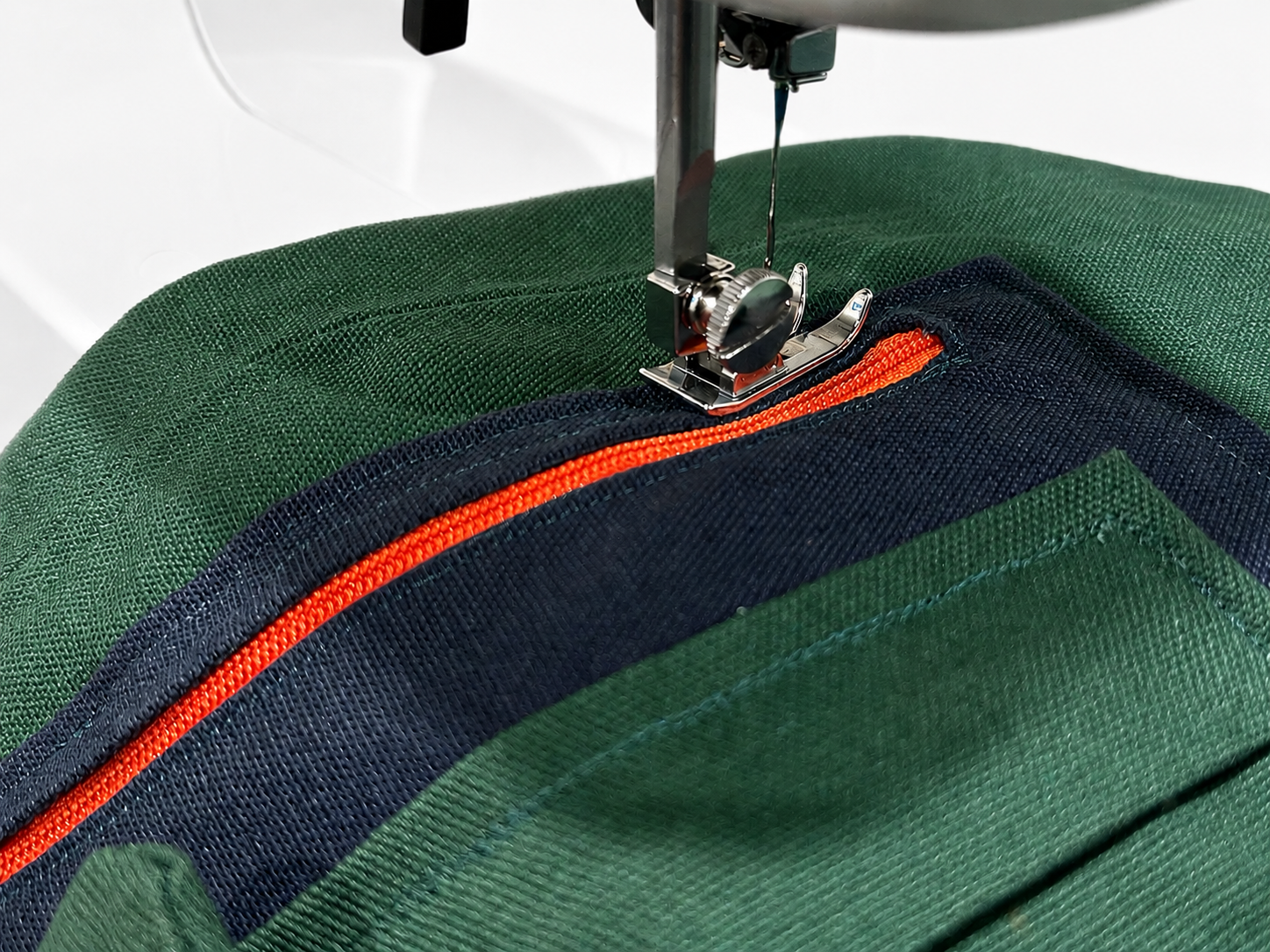 A close-up of our signaturte pants being sewn by hand.