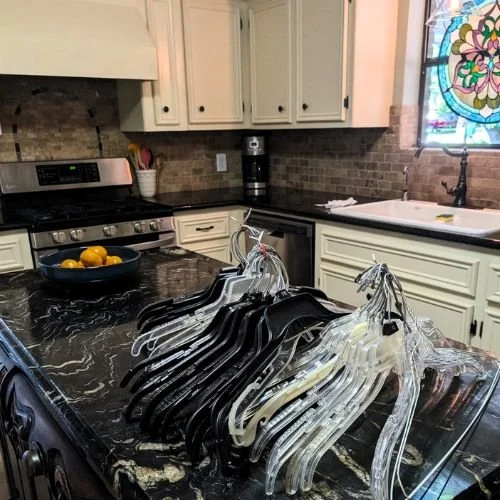 A variety of hangers bundled on a kitchen counter