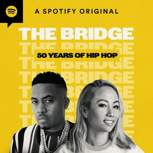 Cover art for Spotify original podcast titled 'The Bridge: 50 Years of Hip Hop,' featuring black and white photos of a man and a woman on a yellow background with the title and subtitle in bold text.