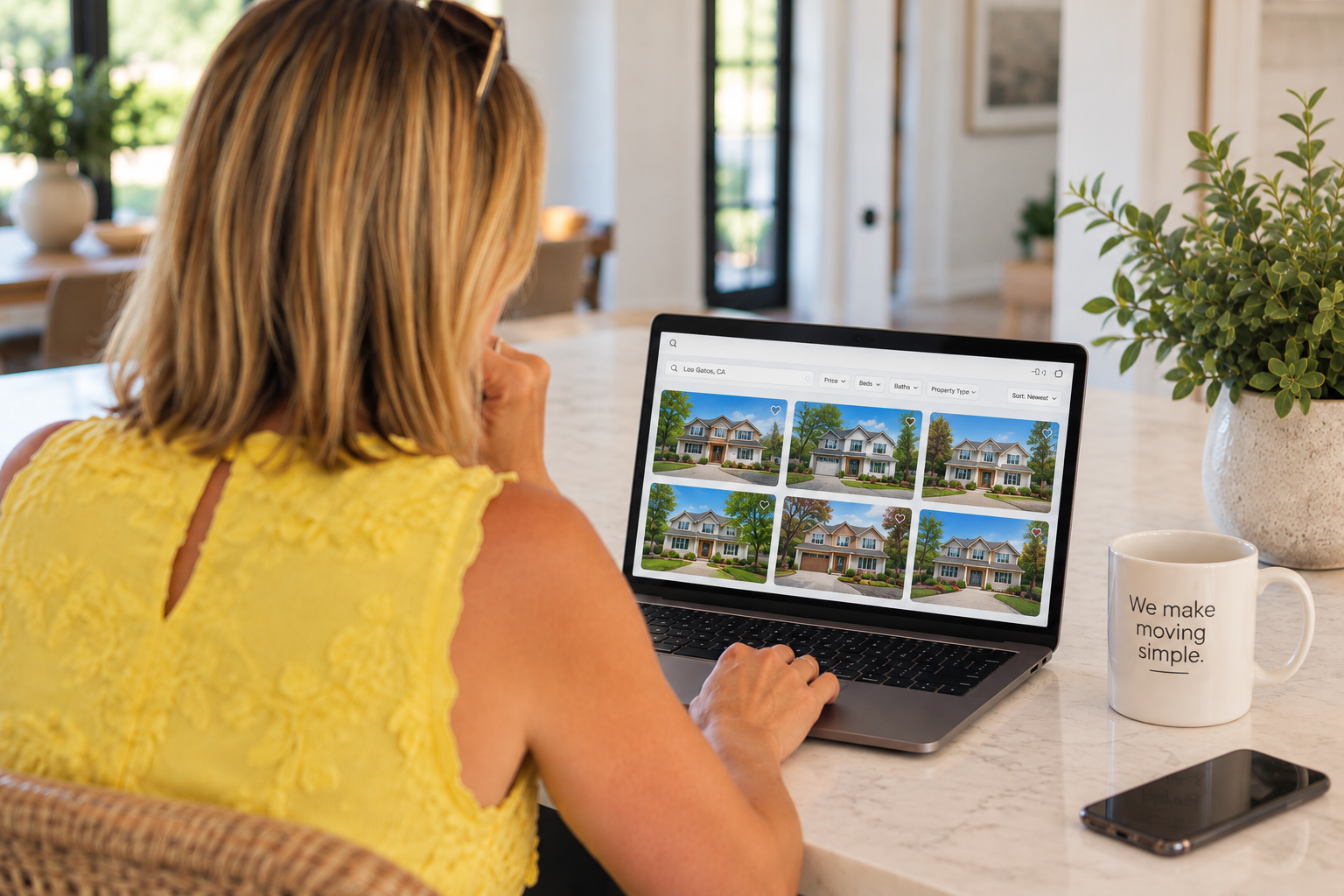 Woman searching online home listings on a laptop, exploring available and off-market opportunities during her Silicon Valley home search.