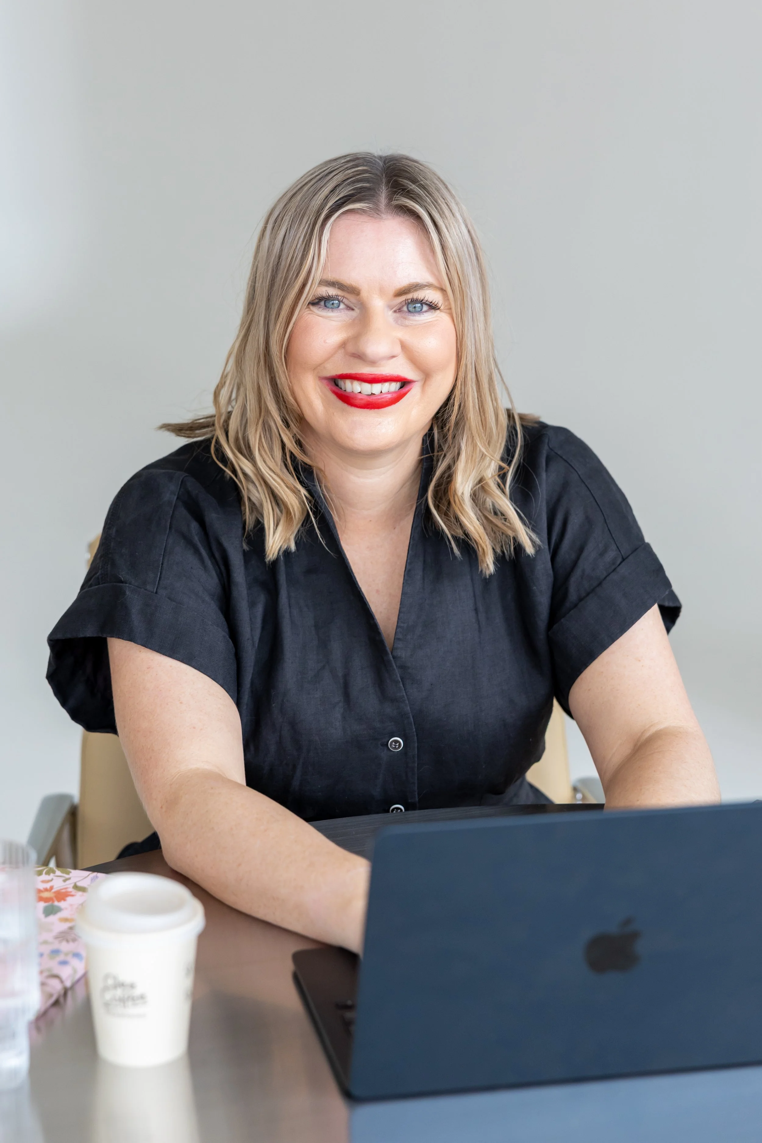Bec Sands, author and creator of the Visible Unicorn Challenge, works at her desk