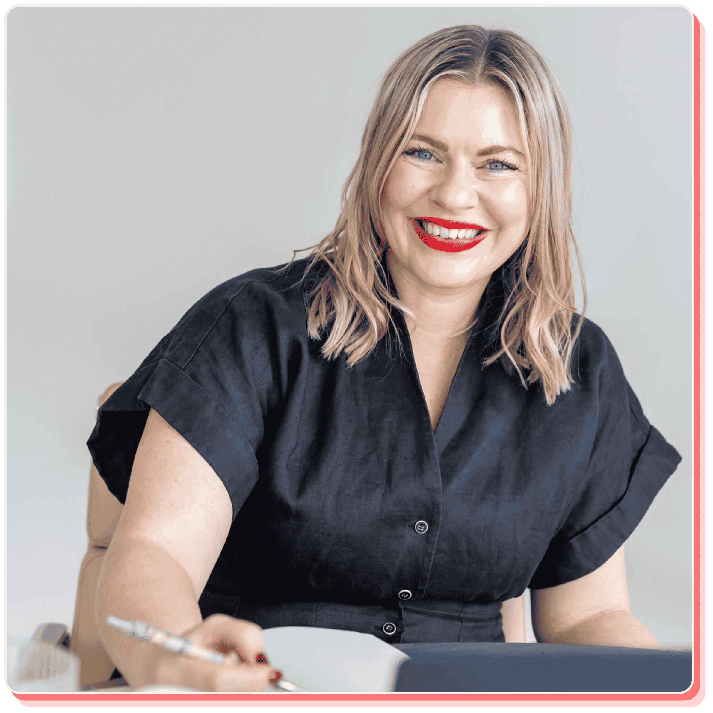 Bec Sands, author of What You Came Here to Create, writing at a desk