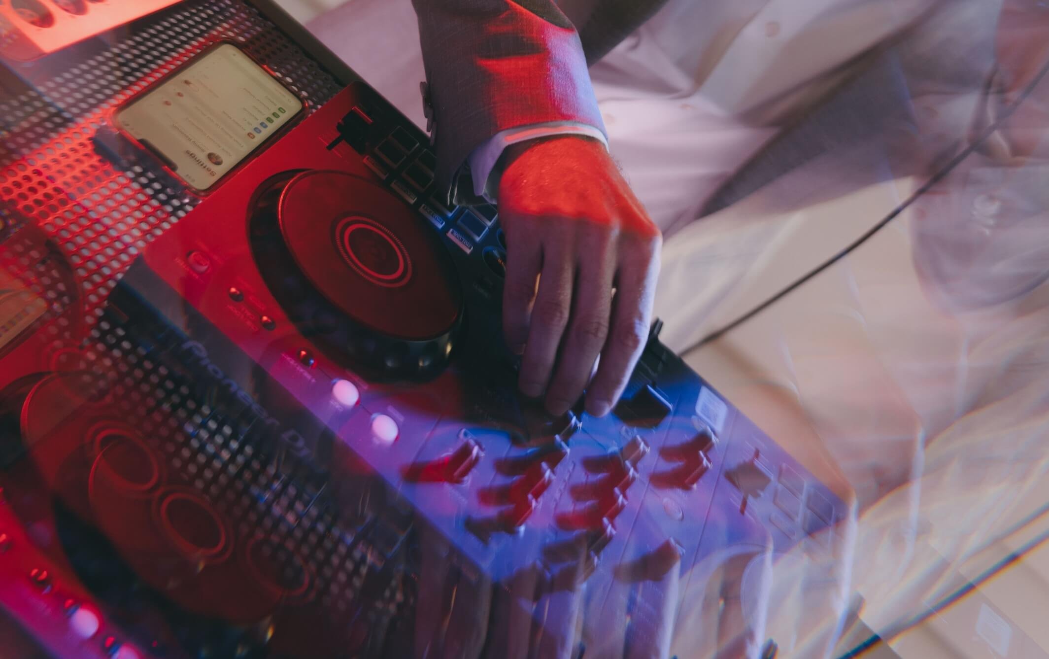 How do I choose between a wedding band or a wedding DJ?