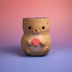 A small, bear-shaped ceramic container holding a pink seashell, set against a pink and purple gradient background. - Glen Deiter