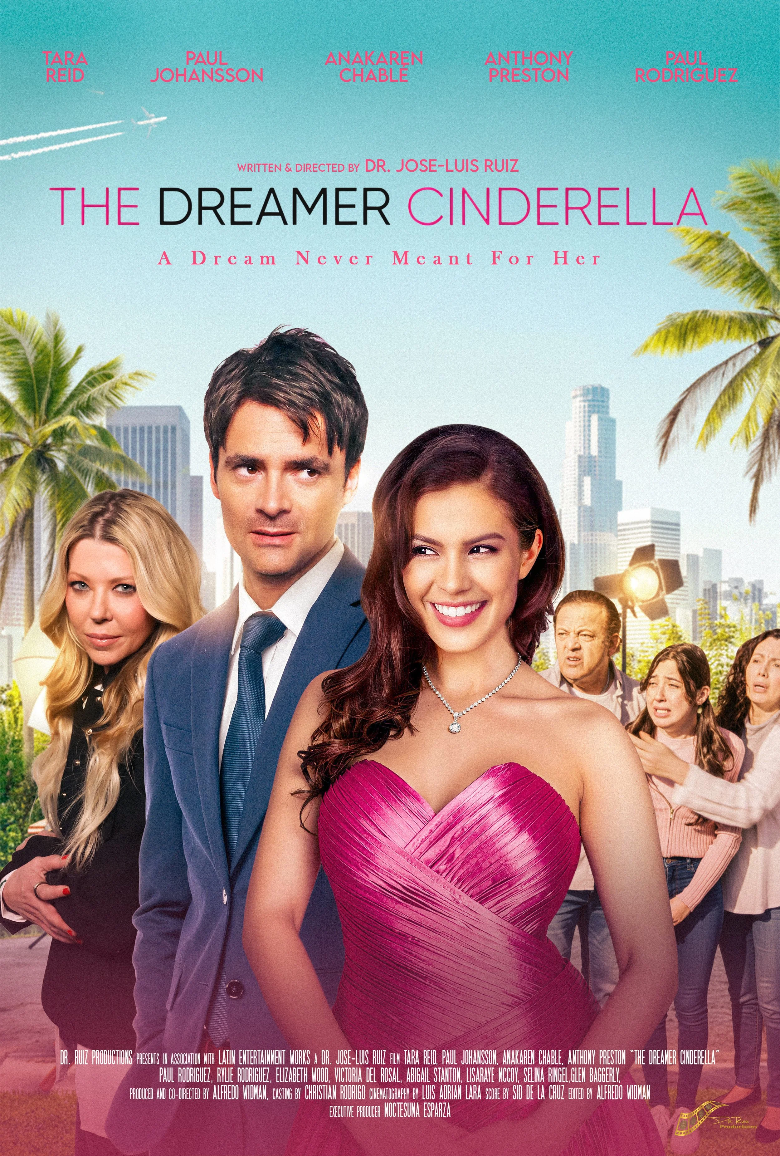 Promotional poster for the movie 'The Dreamer Cinderella' featuring a woman in a pink dress at the center, with several people in the background and a city skyline, palm trees, and an airplane in the sky.