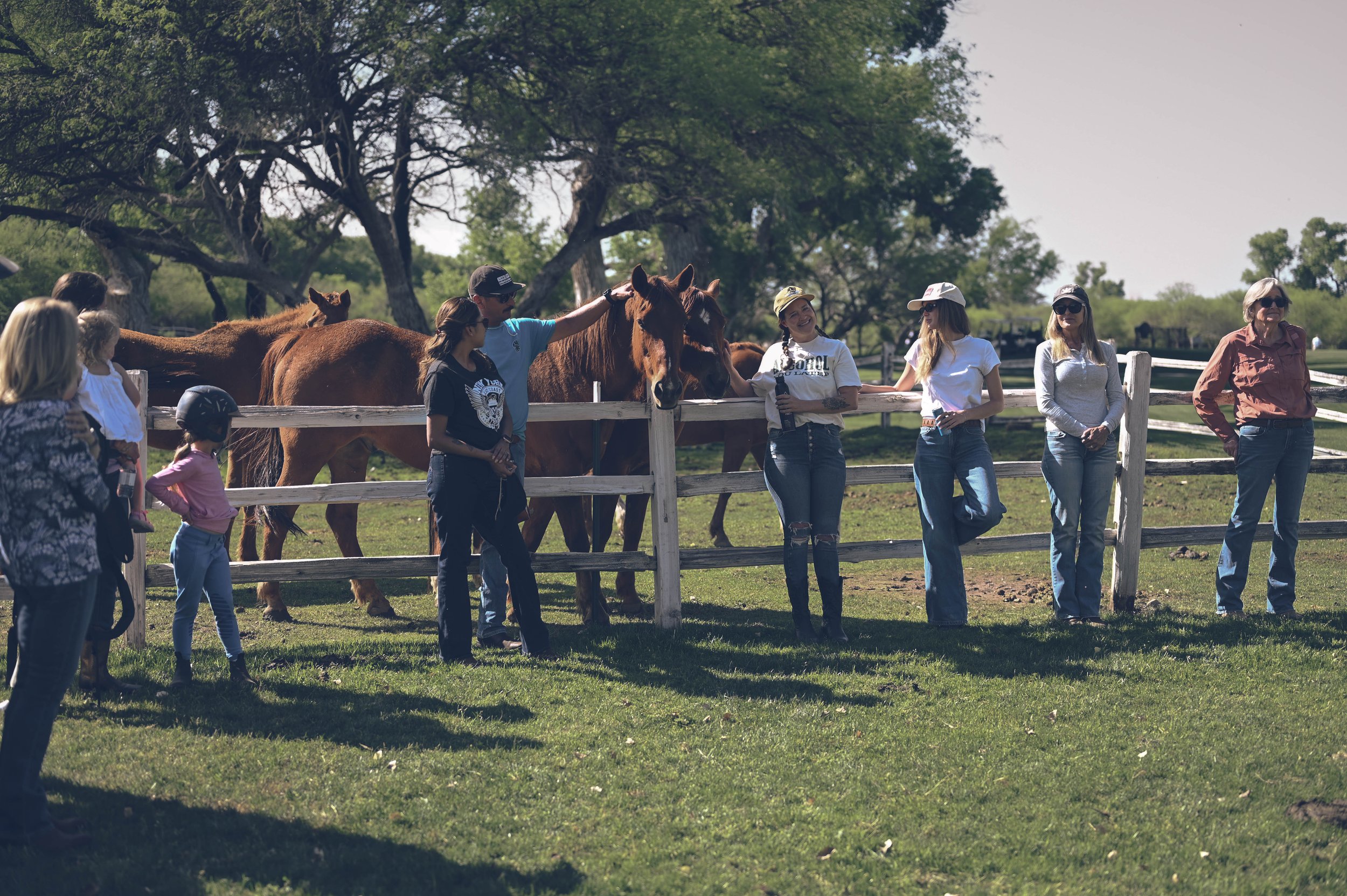 Dude ranch guests gather in the corrals of Otero Ranch at Tubac Golf Resort. 
